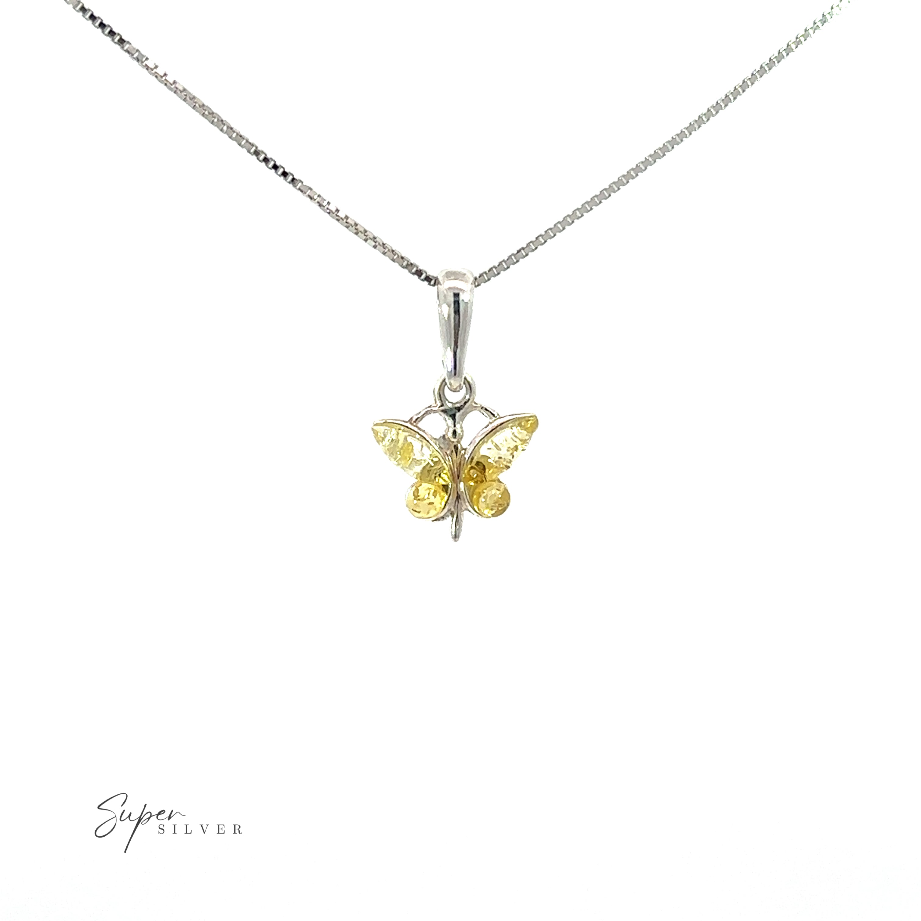 A small amber butterfly pendant with a yellow sapphire on a silver chain, perfect for daily style.