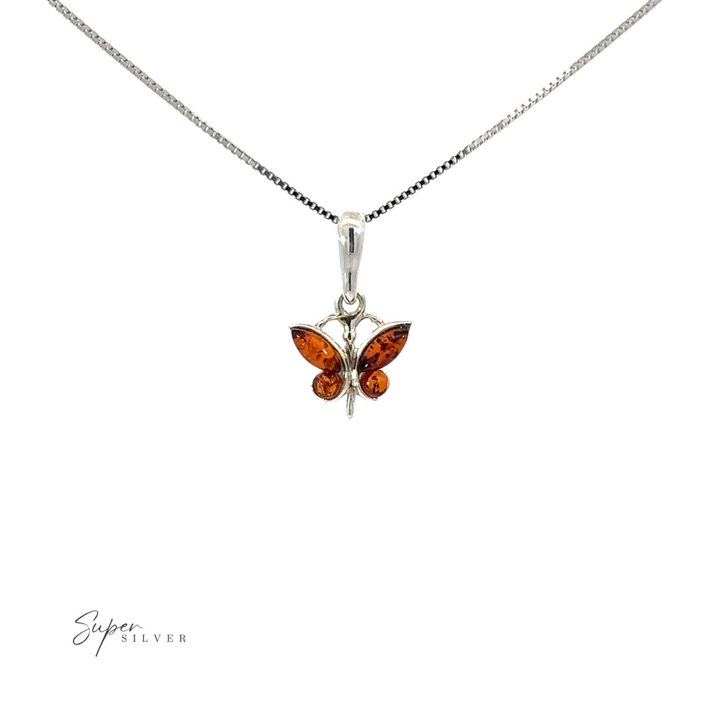 
                  
                    Small Amber Butterfly Pendant in sterling silver, inspired by nature.
                  
                