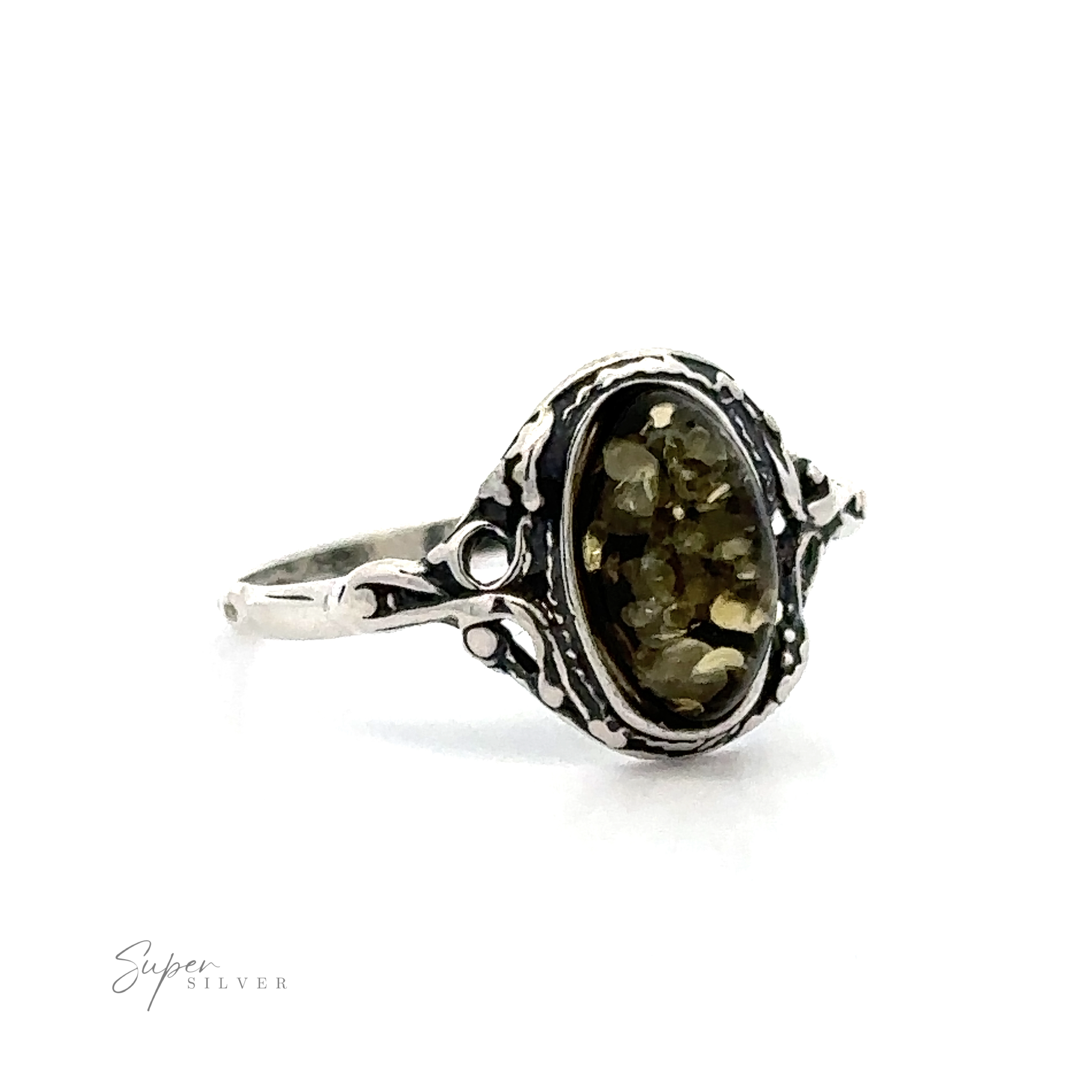 Delicate Baltic Amber Ring with Antique Setting with an oval, faceted cognac amber gemstone in a detailed filigree setting, displayed against a white background.