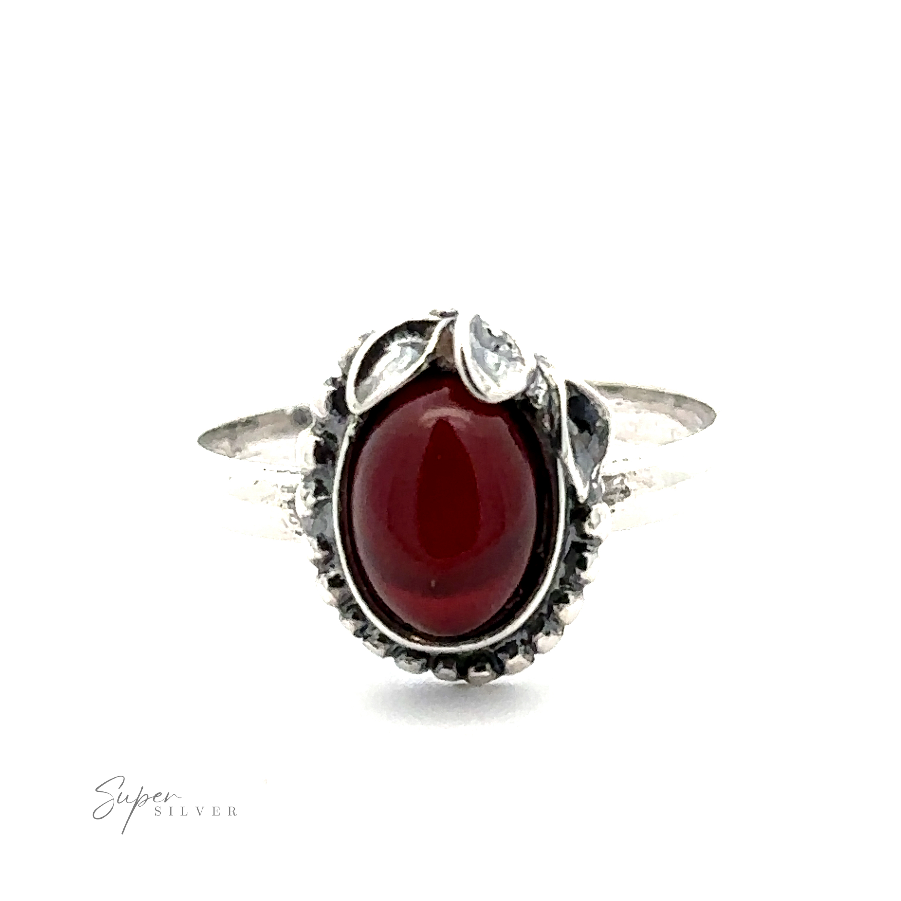 An Amber Ring with Beaded Border and Peace Lily Details, featuring a central polished red stone, flanked by two leaf-like elements on a plain band, embodies vintage elegance. This nature-inspired jewelry piece adds timeless beauty to any collection.