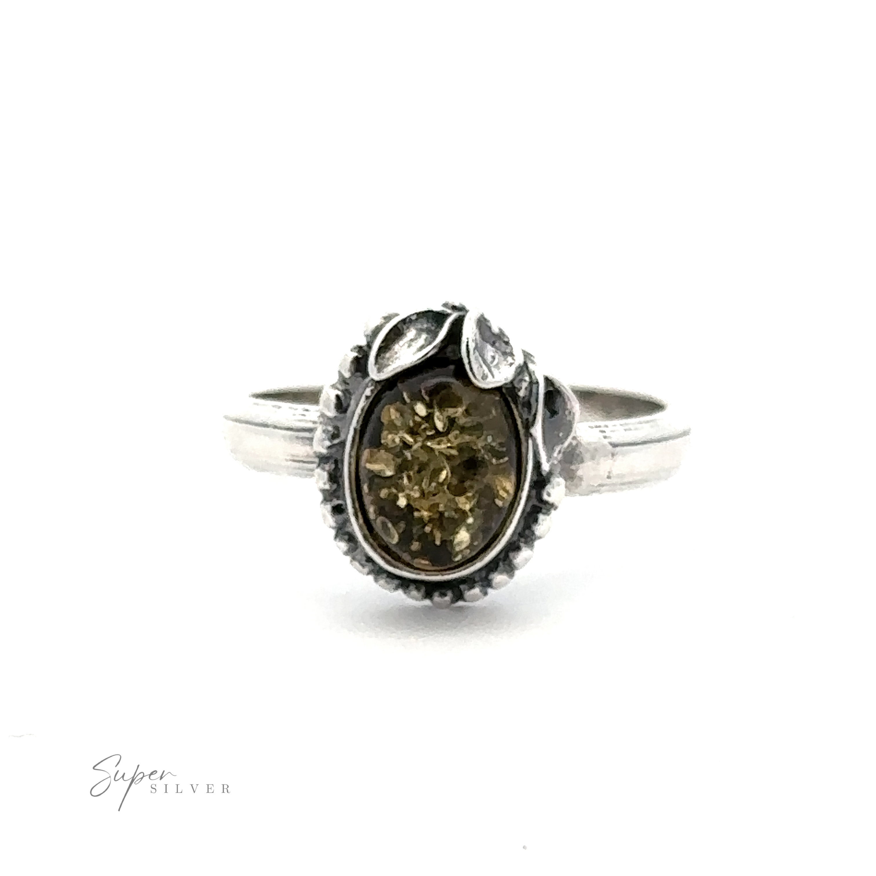 The Amber Ring with Beaded Border and Peace Lily Details exudes vintage elegance, featuring a silver band with an oval-shaped amber gemstone displayed against a white background. Surrounded by detailed metalwork resembling leaves, this nature-inspired jewelry piece captures timeless beauty.