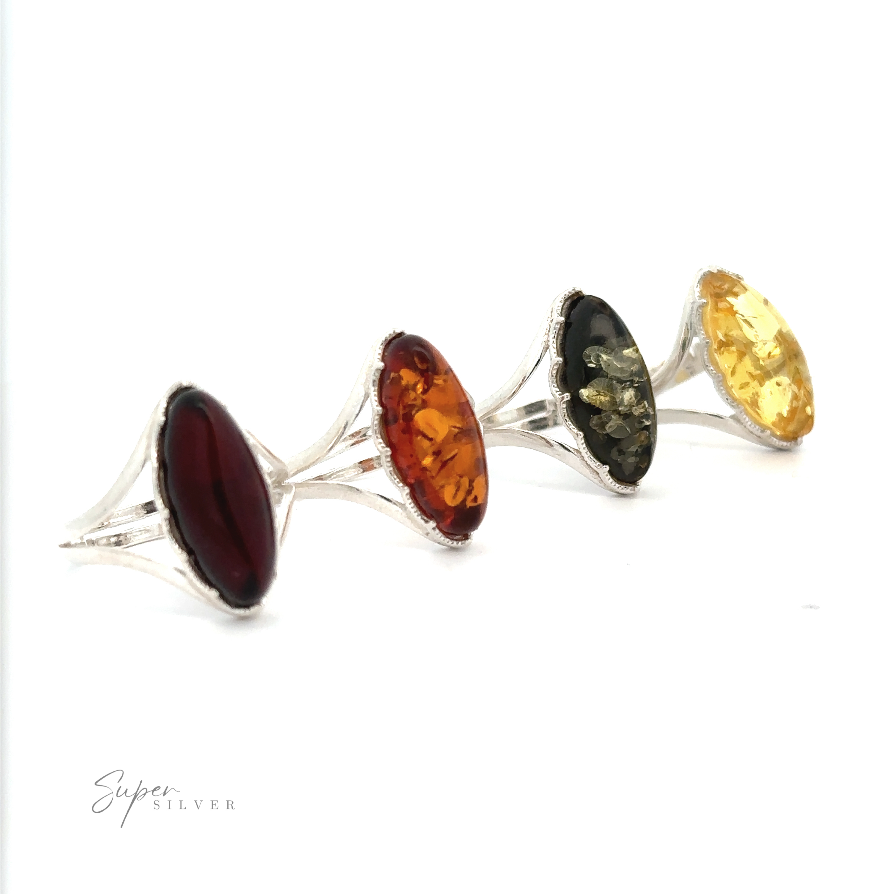Four silver rings with large oval stones in red, orange, black, and yellow hues arranged in a line on a white background. A Marquise-Shaped Baltic Amber Adjustable Ring stands out among them. Text "Super Silver" is visible in the bottom left corner.