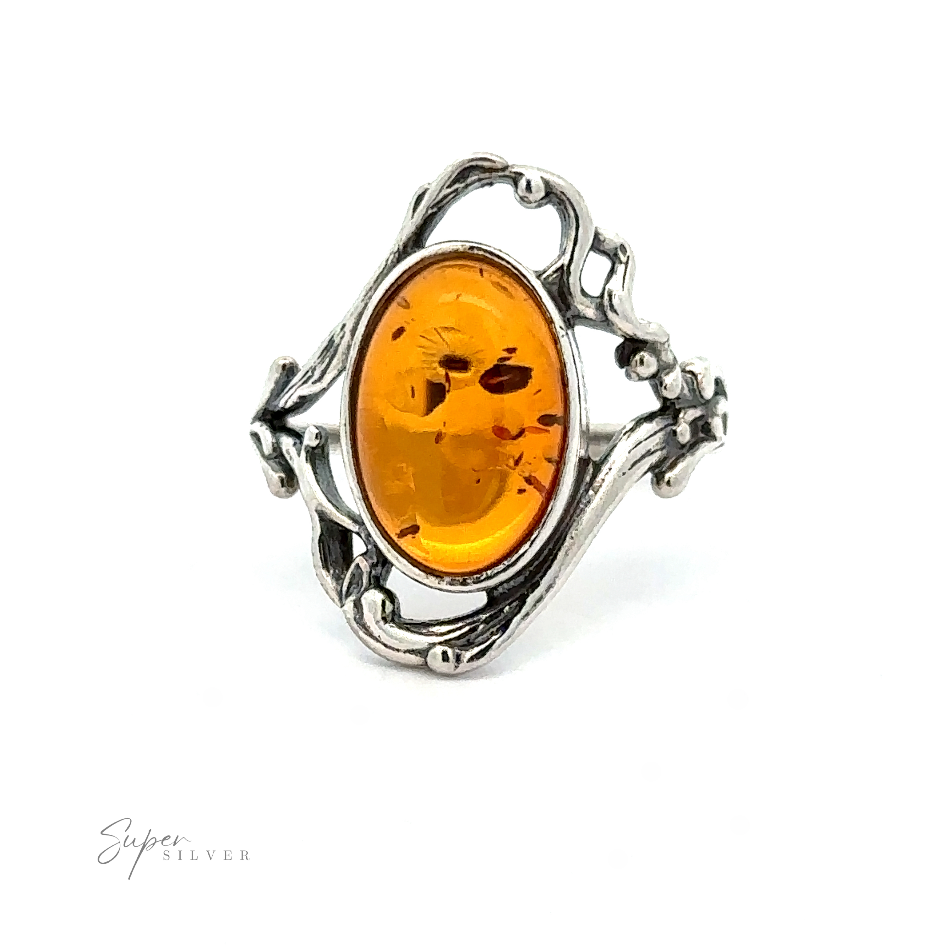 An Amber Ring with Vine Detailing featuring an oval amber stone with an intricate vine design, exuding antique allure.