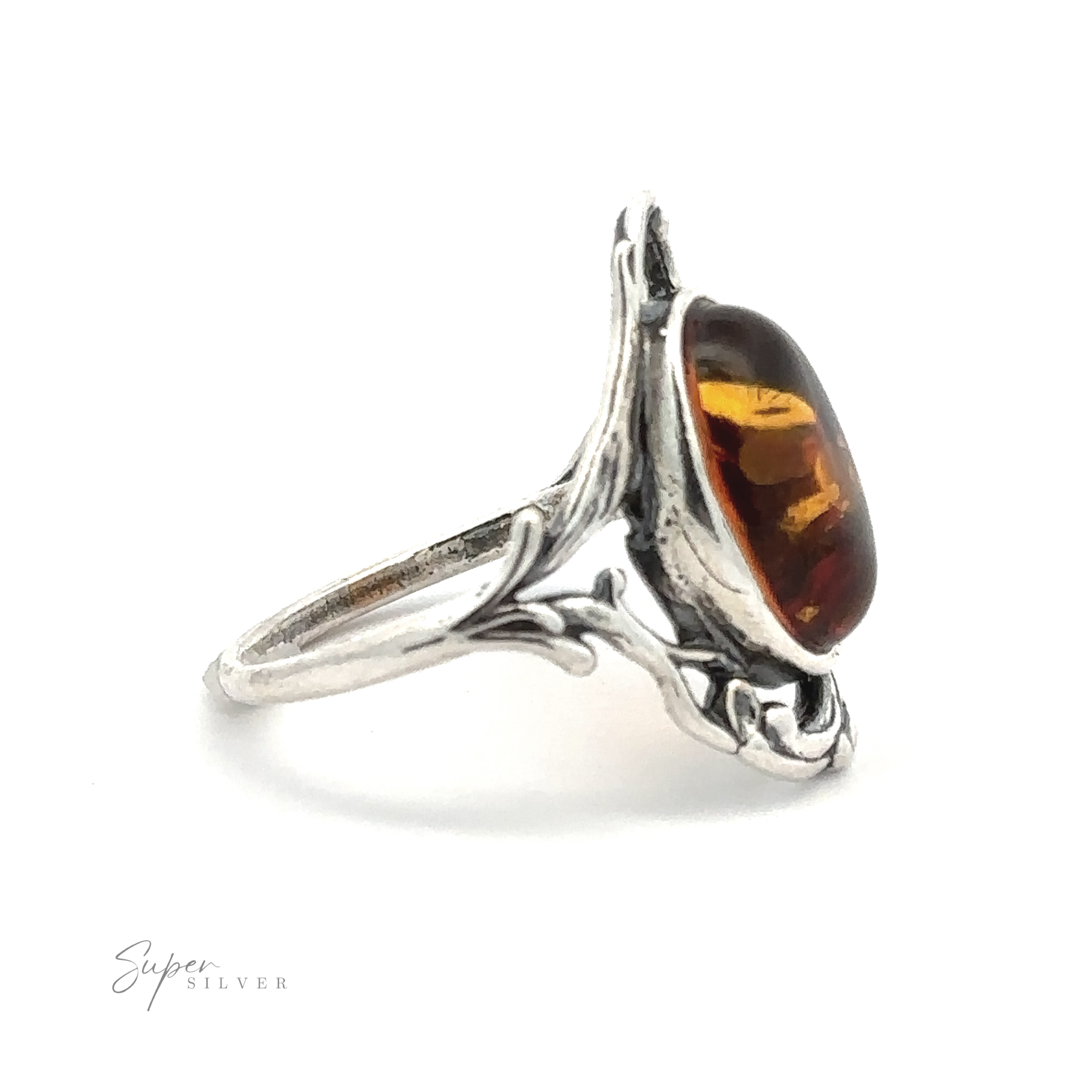 A silver ring featuring an Amber Ring with Vine Detailing in an ornate, vintage design setting. The brand name "Super Silver" is visible in the lower left corner, adding to its Antique Allure.