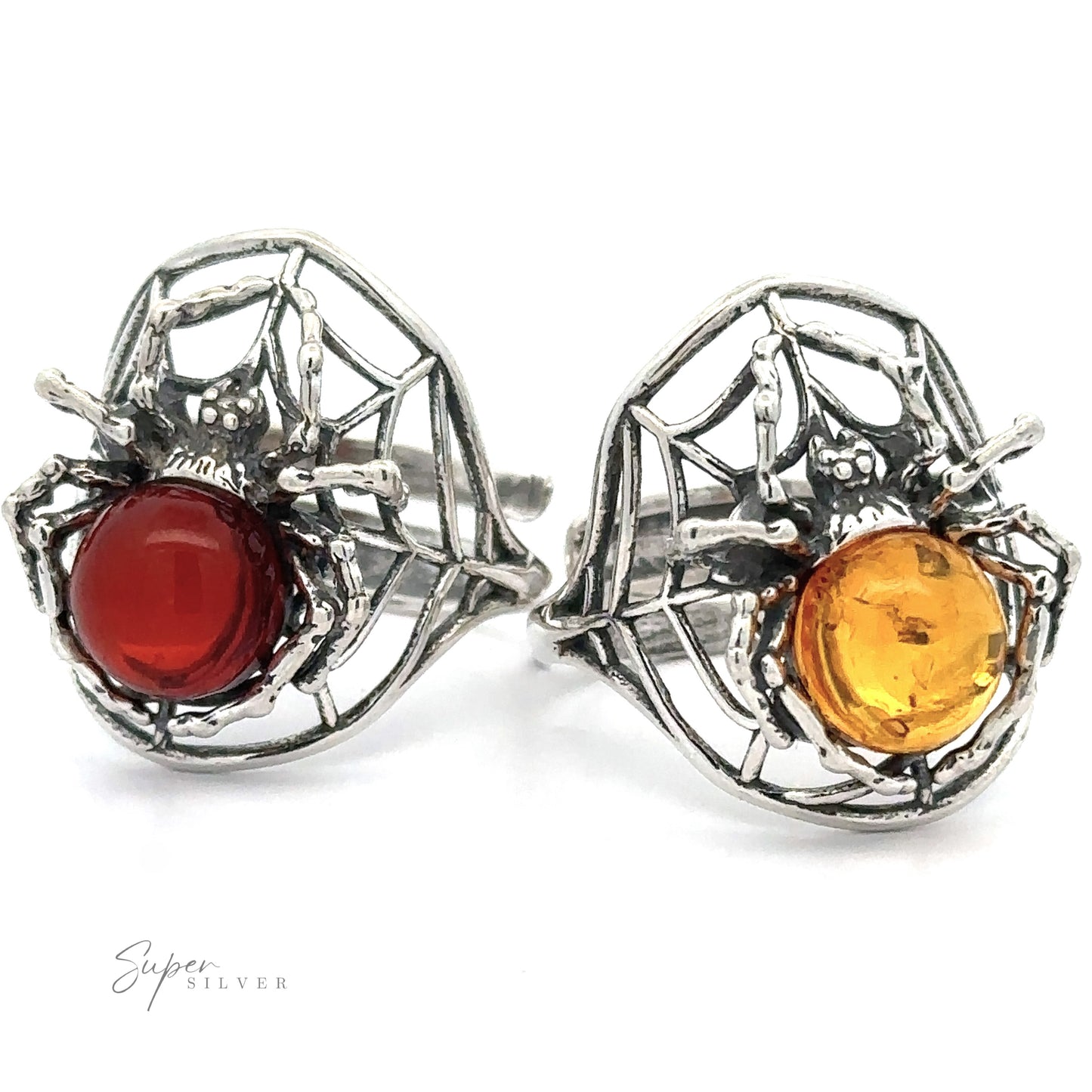 Two Entrancing Adjustable Baltic Amber Spider Rings (one red, one cognac Baltic amber) displayed on a white background.
