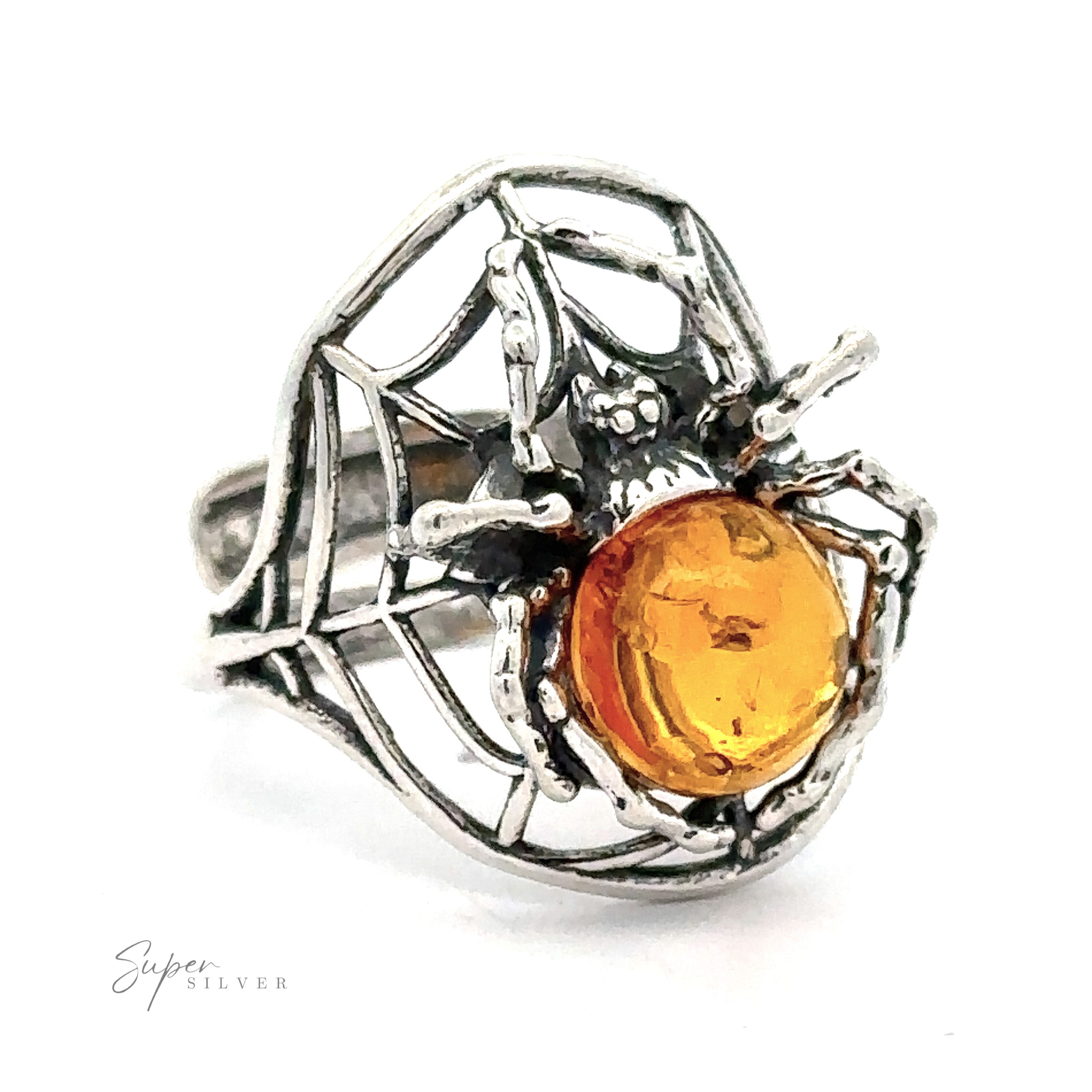 Entrancing Adjustable Baltic Amber Spider Ring with a cognac Baltic amber body, crafted with intricate web detailing, displayed on a white background.