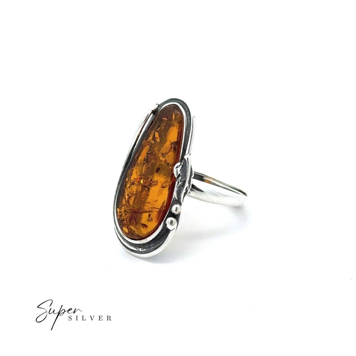 Golden Amber Adjustable Statement Ring featuring an elongated oval Baltic amber stone set in a sterling silver bezel, displayed on a white background with “Super Silver” text in the corner.