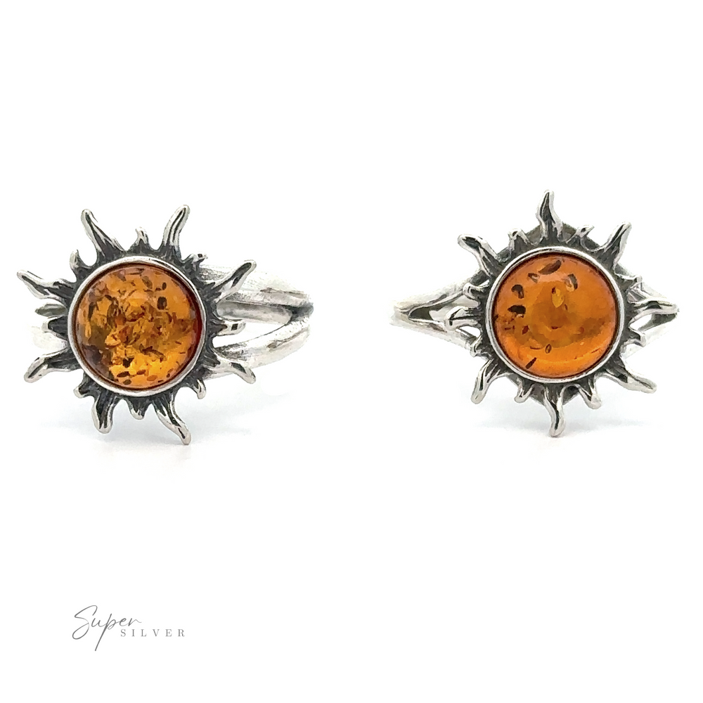 A pair of Glowing Amber Sun Ring earrings with Baltic amber centers set against a white background.