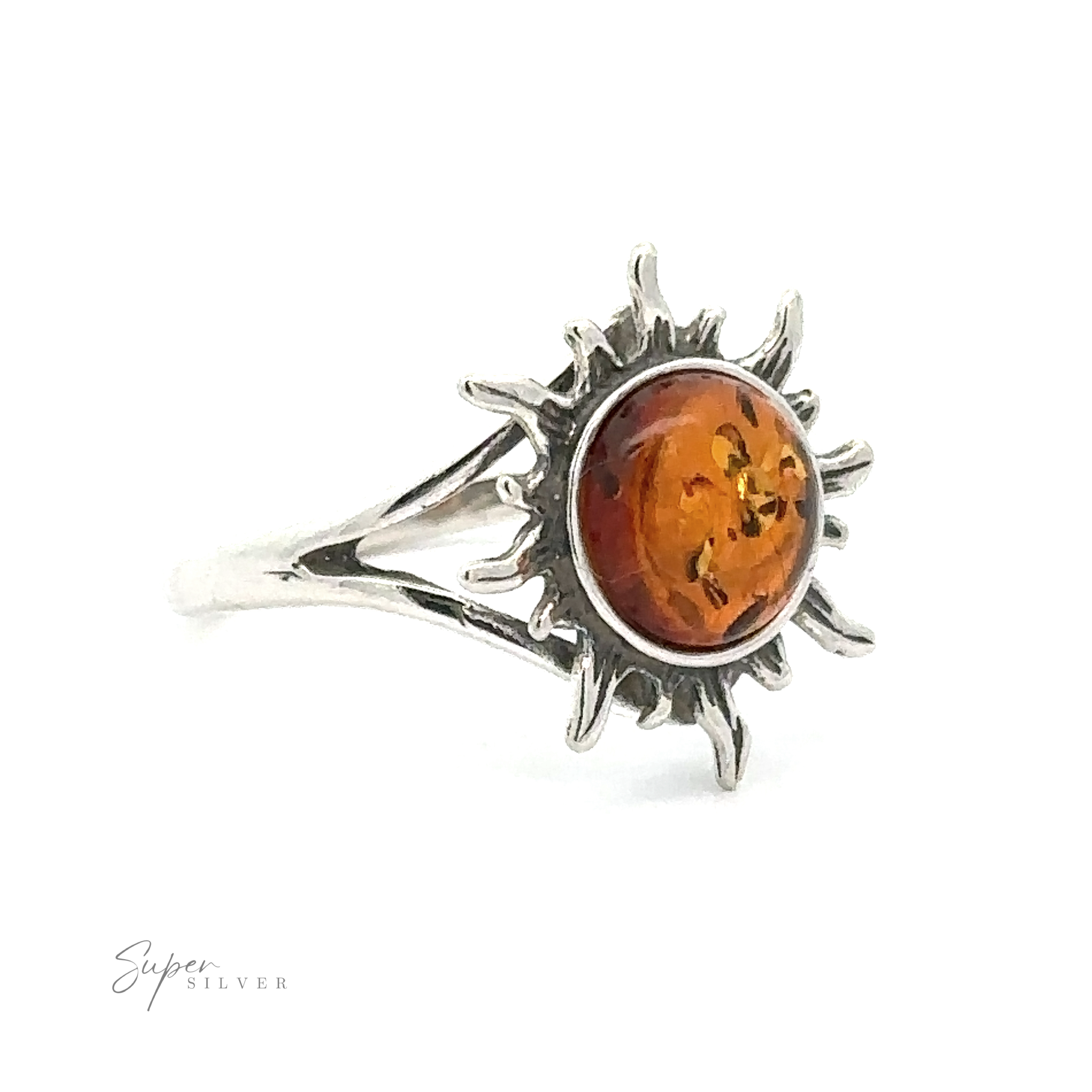 Glowing Amber Sun Ring featuring a sunburst design with an orange Baltic amber center stone, displayed against a white background.