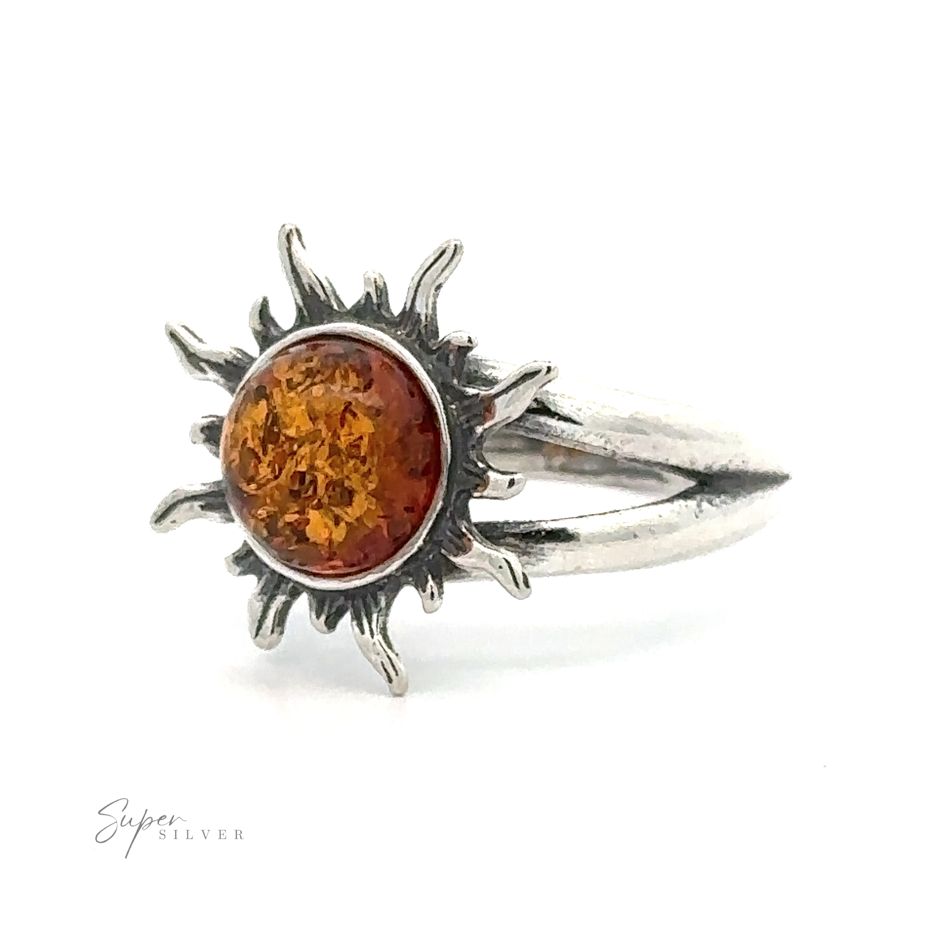 Sentence with product name: Glowing Amber Sun Ring with a sunburst design and a Baltic amber center, displayed against a white background.