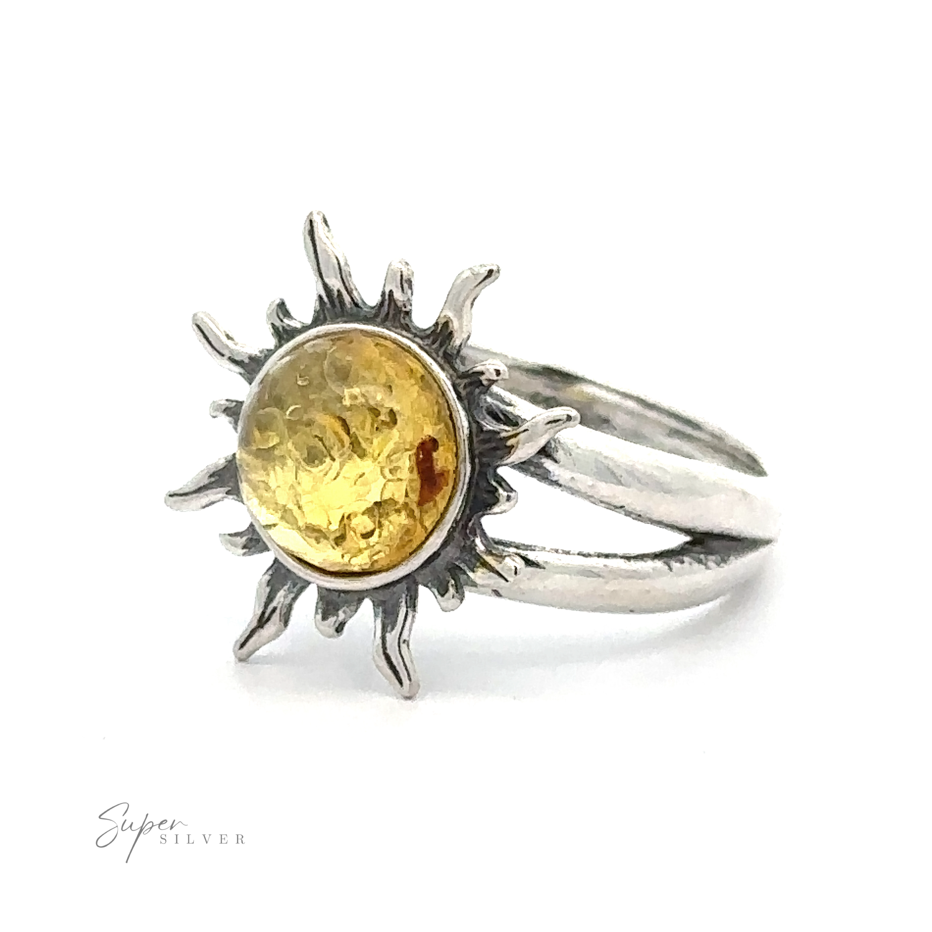 Glowing Amber Sun Ring with a central Baltic amber gemstone, displayed against a white background.