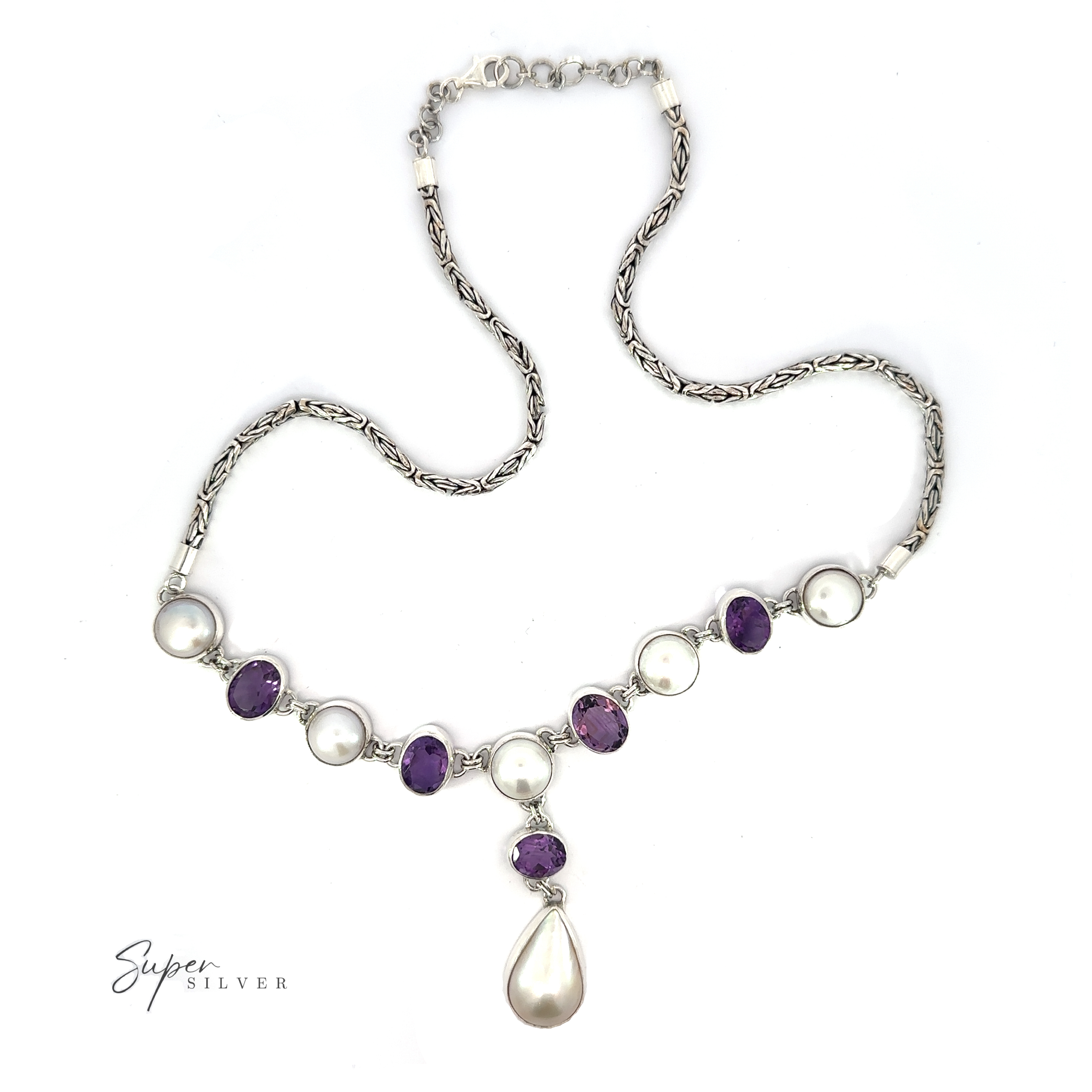 A Stunning Pearl and Gemstone Statement Necklace featuring alternating purple and white gemstones and pearls, with a teardrop-shaped pearl pendant at the center.