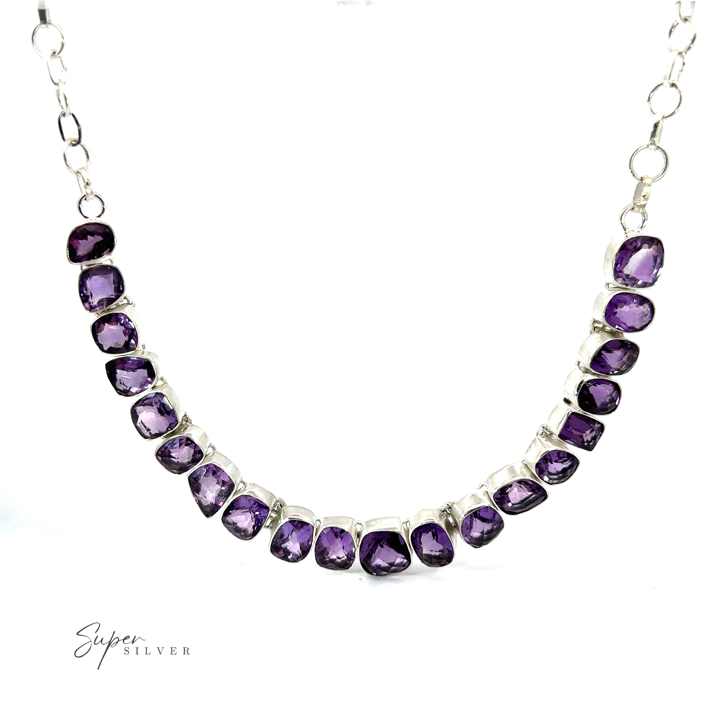 A Statement Gemstone Necklace with a sequence of faceted purple amethysts, arranged in a graduated pattern, is displayed against a white background. The image includes the text "Super Silver" in the bottom left corner.