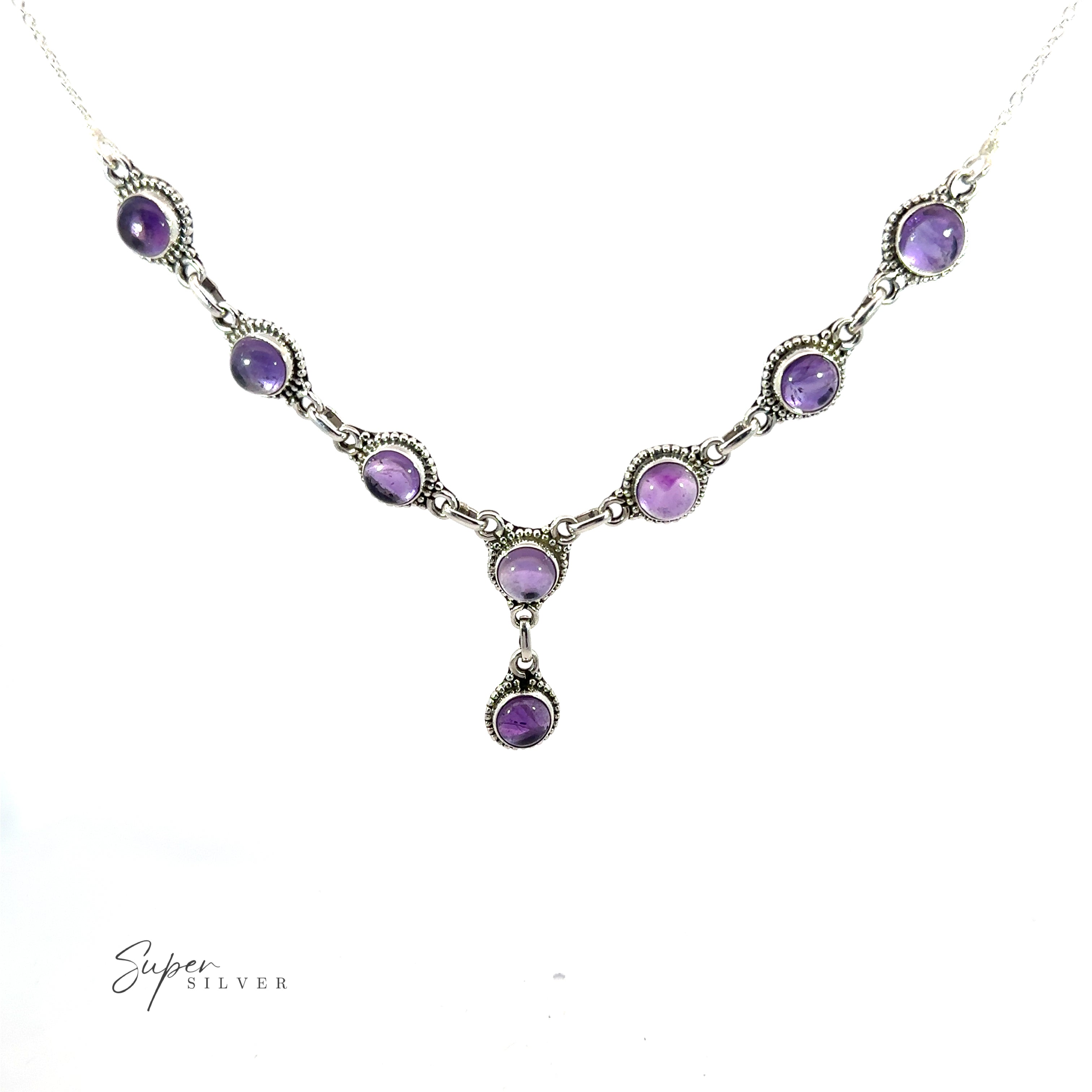 A Round Gemstone Y Necklace with Ball Border necklace with a series of round, purple gemstone pendants set in intricate silver settings, featuring one drop-shaped pendant at its center. This exquisite piece of bohemian style jewelry is branded "Super Silver" in the bottom left corner.