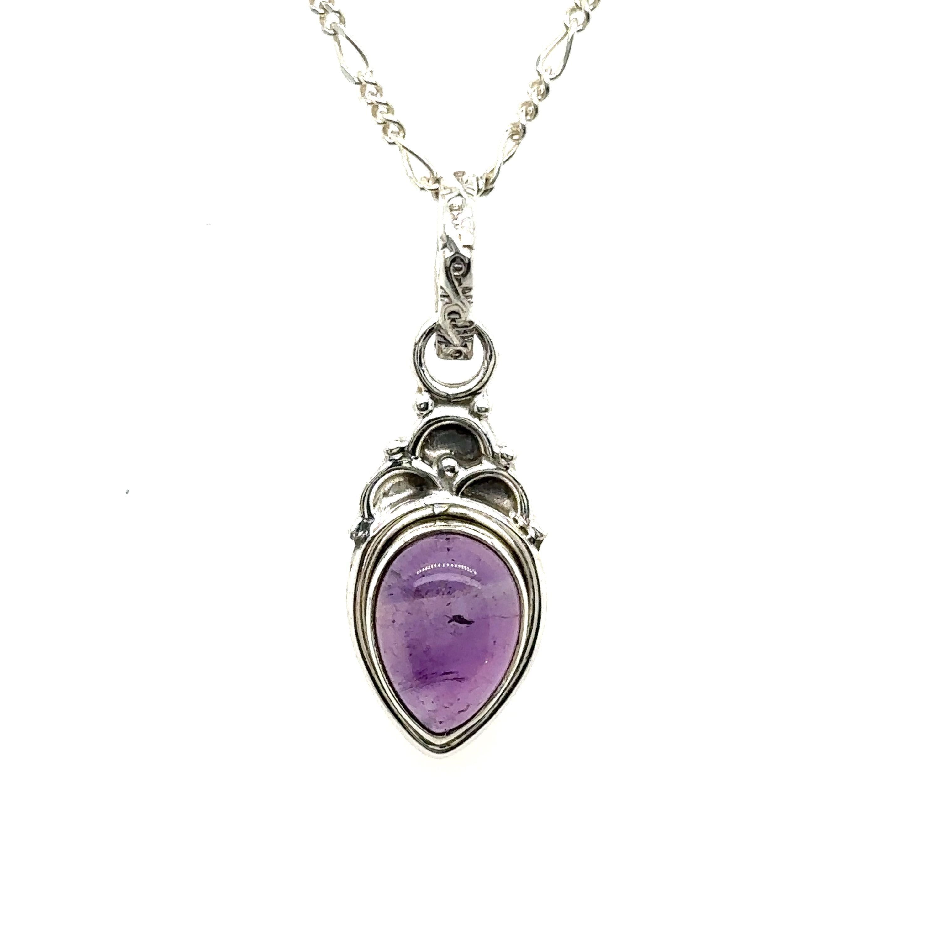 A Dainty Gemstone Teardrop Pendant on a silver chain.