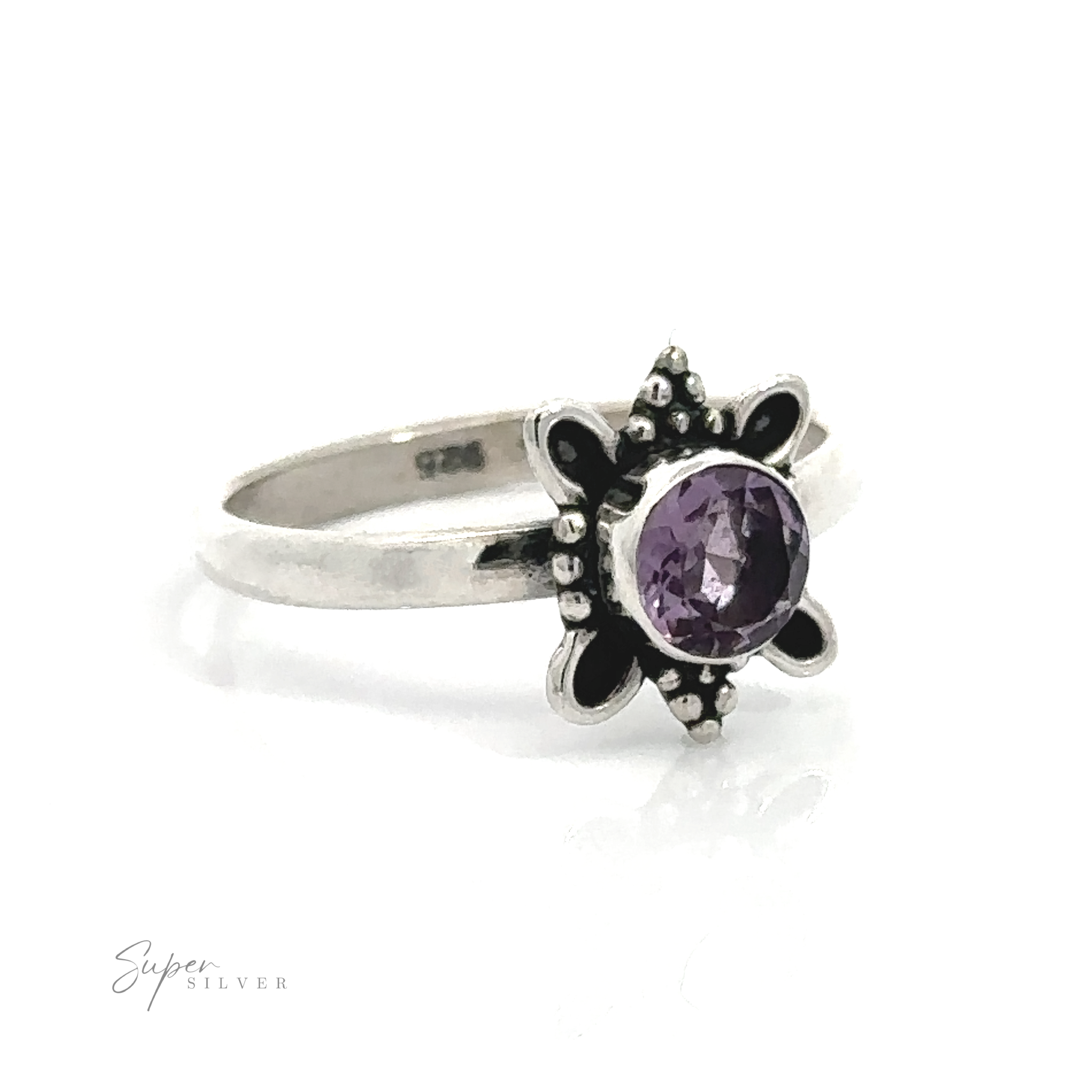 Round Faceted Gemstone Ring with Ball and Loop Design with a purple stone set in a nature lovers-inspired floral design.