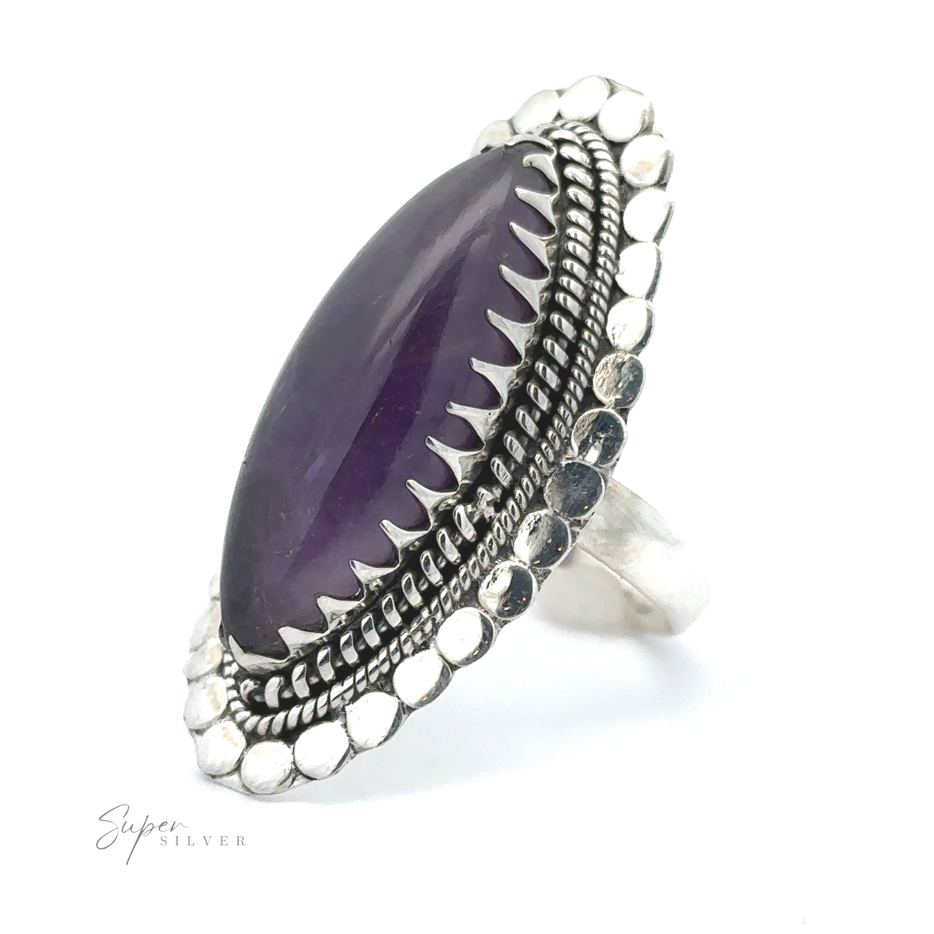 A Statement Marquise Shaped Gemstone Ring with intricate metalwork detailing embodies the essence of Bohemian jewelry.