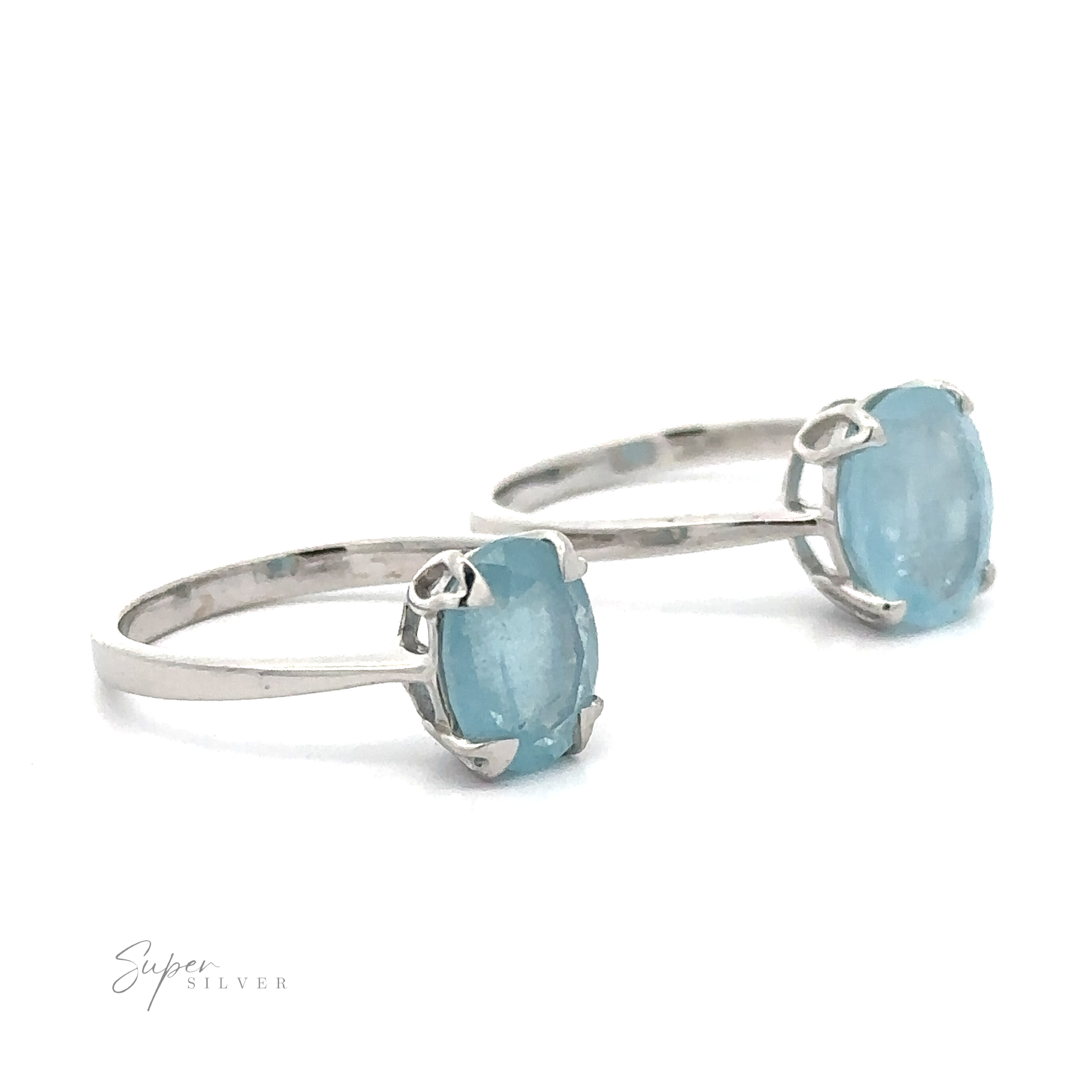 Two aquamarine rings, displayed on a white background.