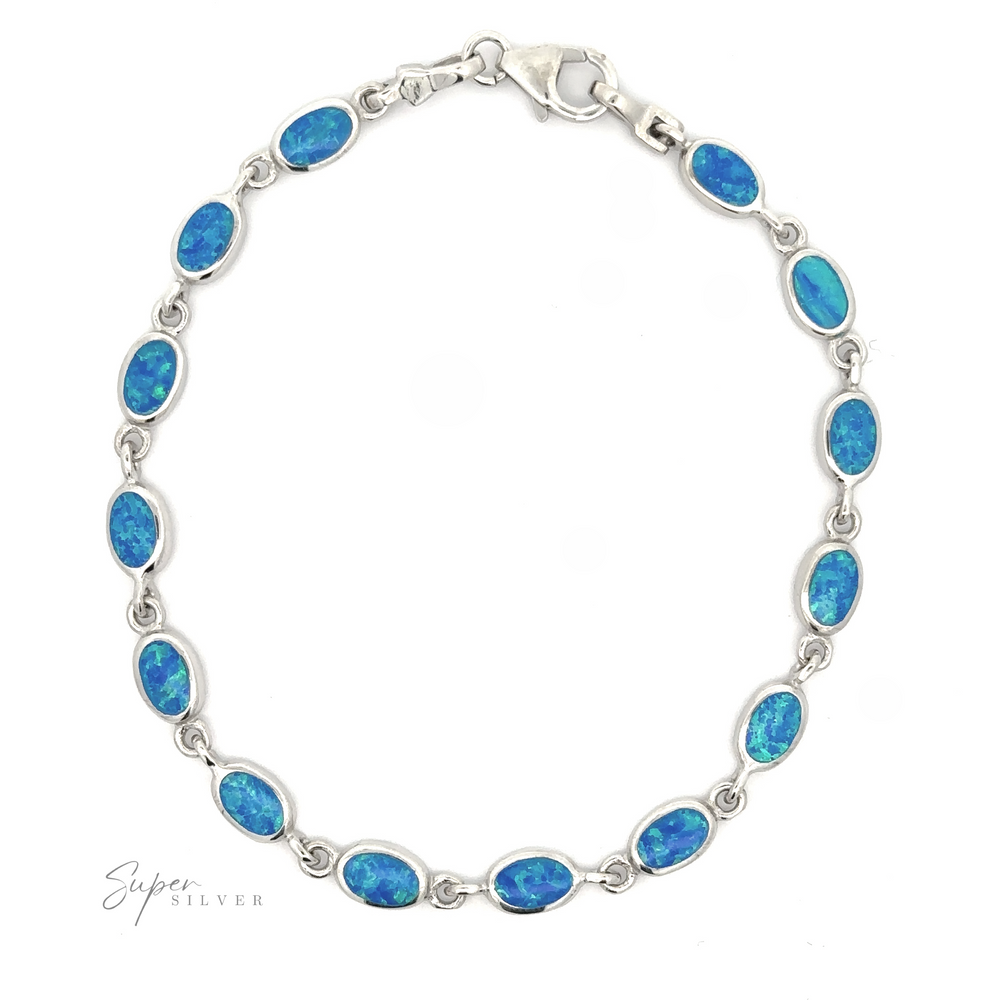 
                  
                    Simple Oval Link Opal Bracelet with oval blue lab-created opal inlays, displayed on a white background.
                  
                