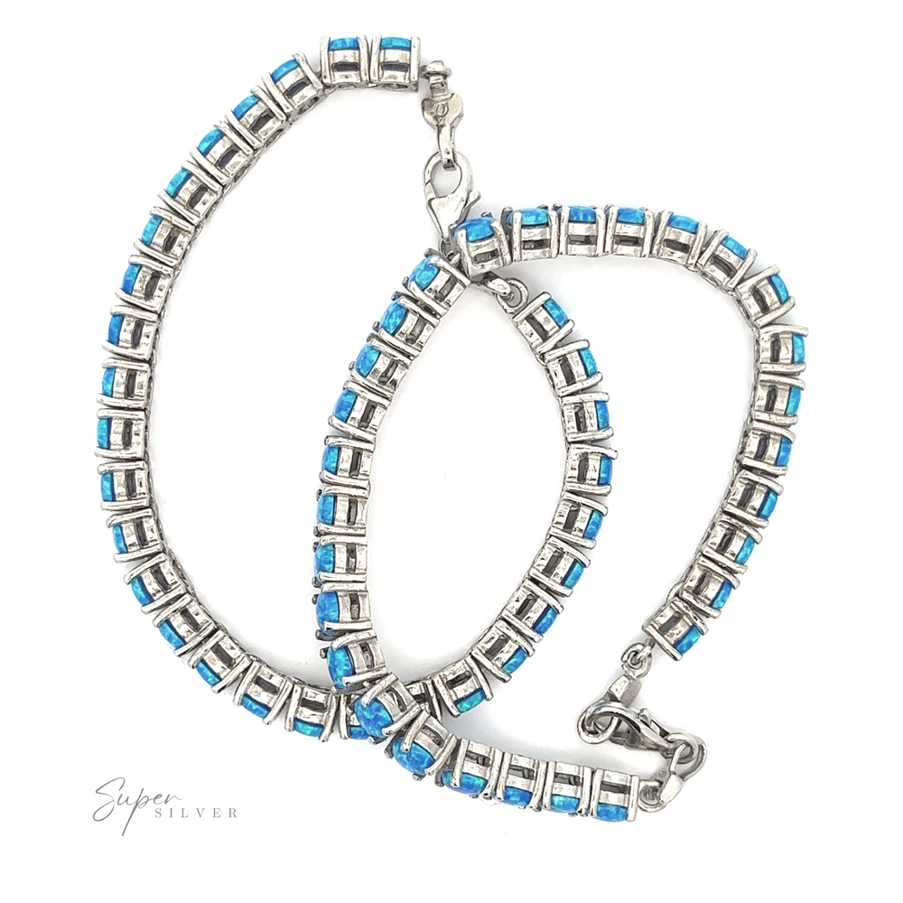 Brilliant Blue Opal Bracelet with clasp fasteners, crafted from .925 Sterling Silver, displayed on a white background.