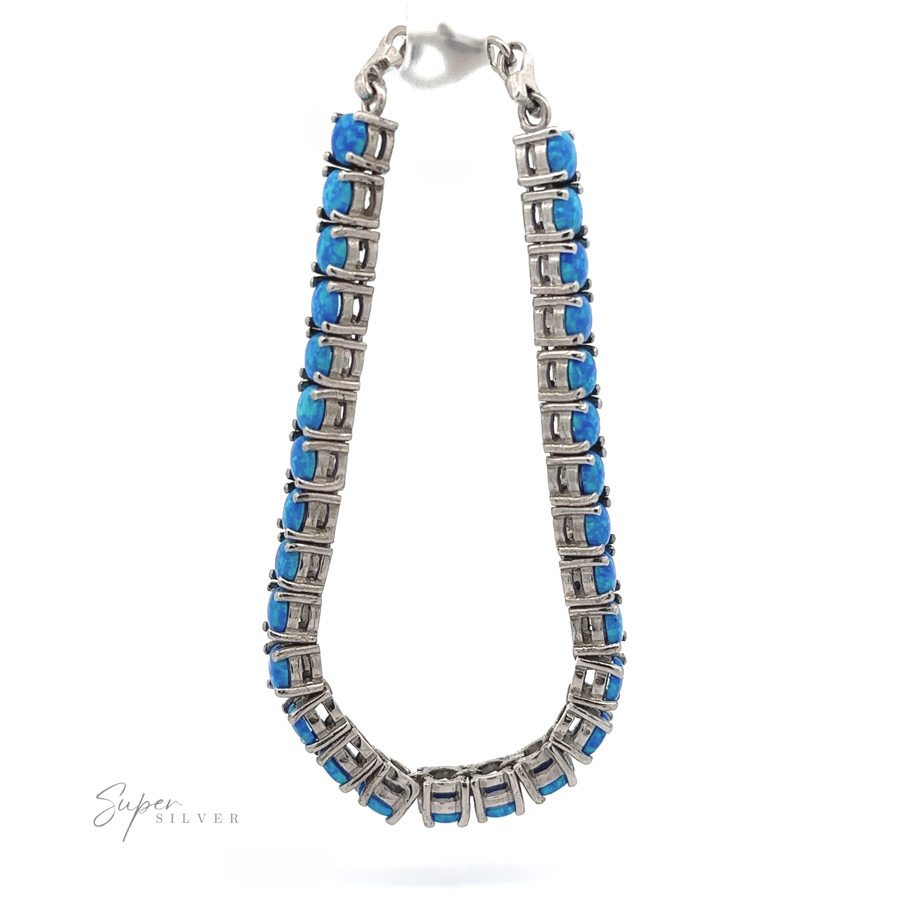 Brilliant Blue Opal bracelet featuring a double row of square-cut blue gemstones set in a rhodium-finished metal frame, isolated on a white background with a signature at the bottom.