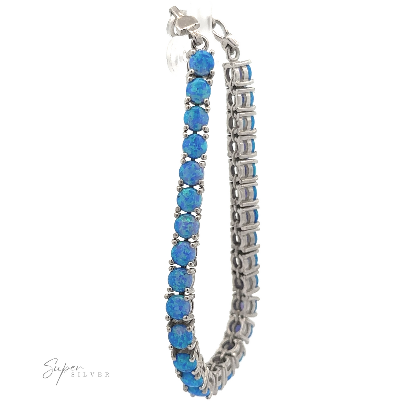 
                  
                    Brilliant Blue Opal Bracelet adorned with a row of small, round blue stones and rhodium finish accents, isolated on a white background.
                  
                
