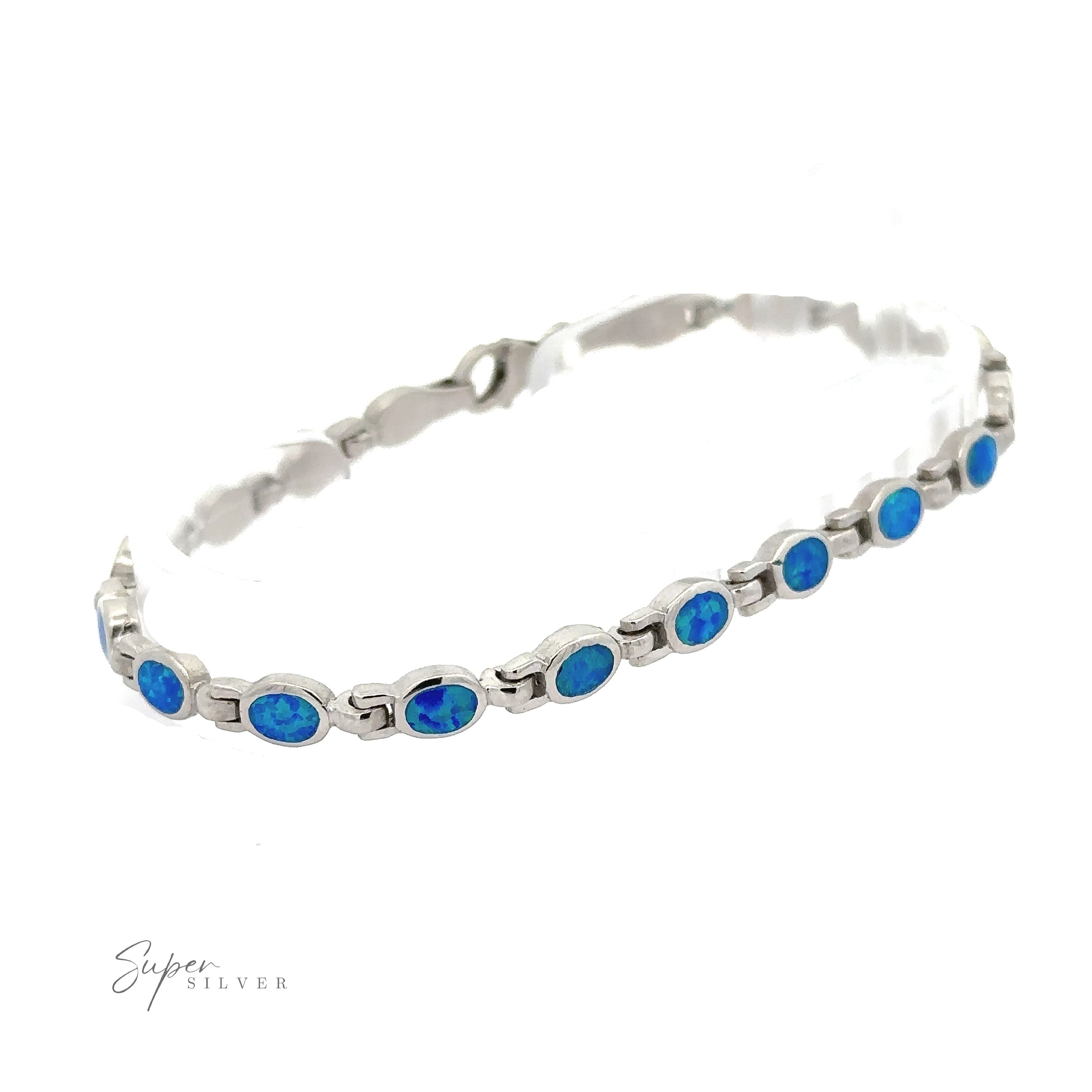 A sterling silver bracelet featuring a chain of linked oval lab-created opals, showcased against a white background. This modern design by "Super Silver" is labeled in the bottom left corner.