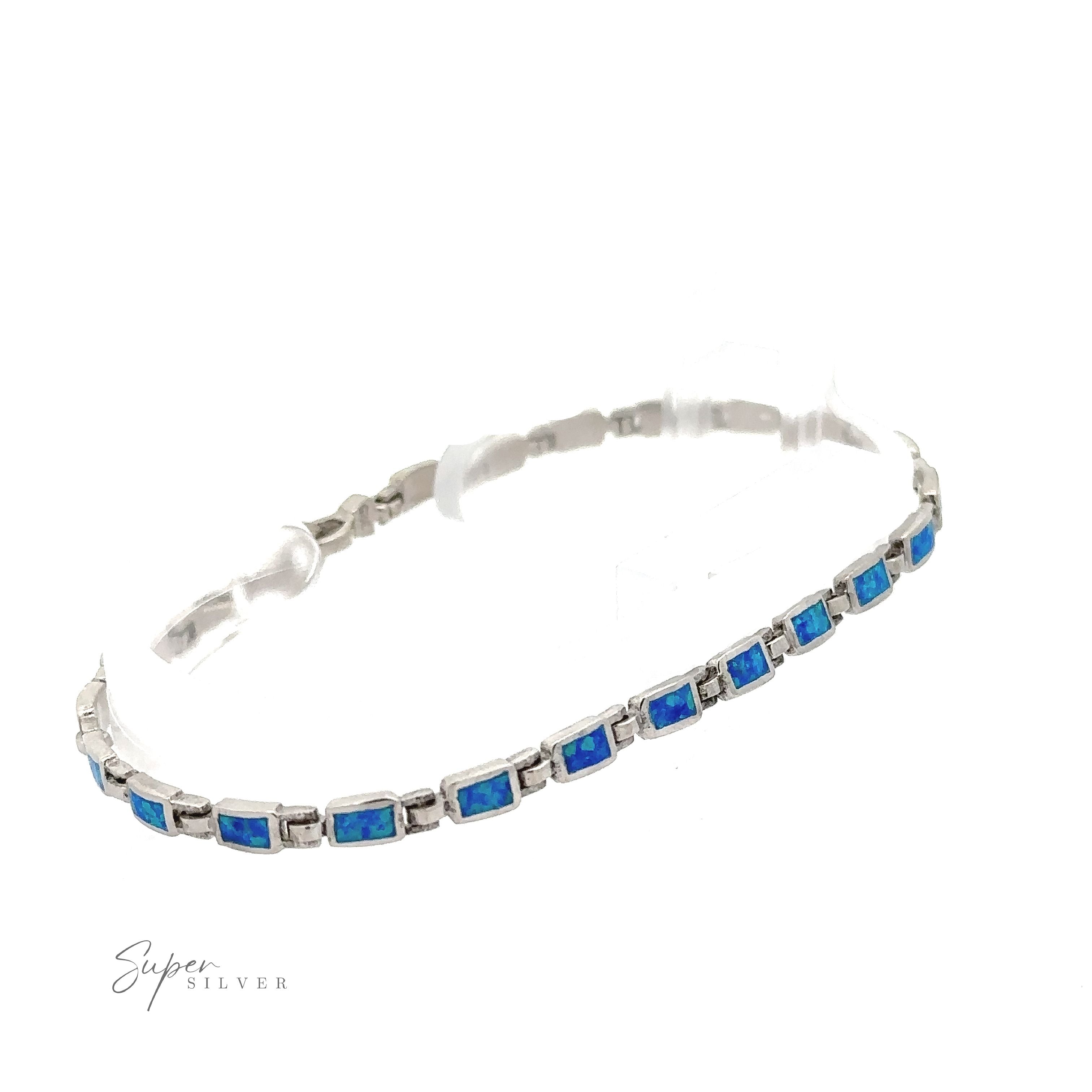 A Rectangle Lab-Created Opal Bracelet, featuring a series of rectangular blue stones connected in a linear pattern. The "Super Silver" logo is visible at the bottom left corner, showcasing modern elegance jewelry at its finest.