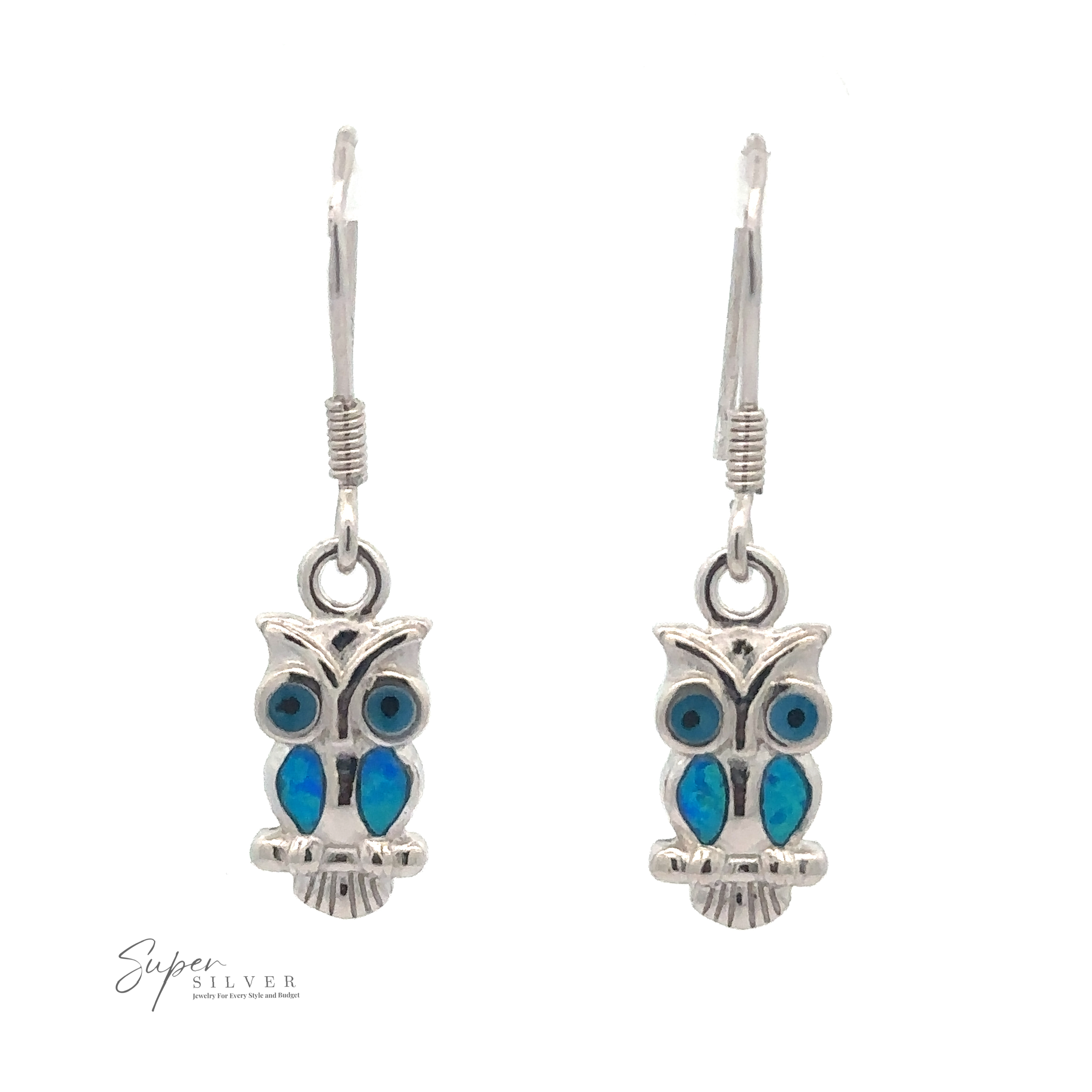 Lab-Created Opal Owl Earrings with blue inlay details, hanging from simple hook ear wires. Ideal for those seeking unique owl jewelry, the "Super Silver" logo is displayed at the bottom left.