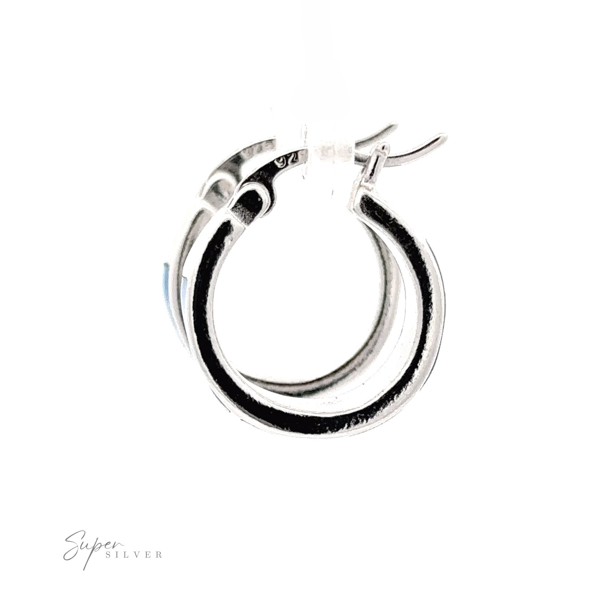 Close-up of two Blue Lab-Created Opal Huggie Hoop Earrings with latch back closures on a white background. The brand name "Super Silver" is visible in the lower left corner. These elegant hoops feature a stunning rhodium finish, adding to their sleek and polished look.
