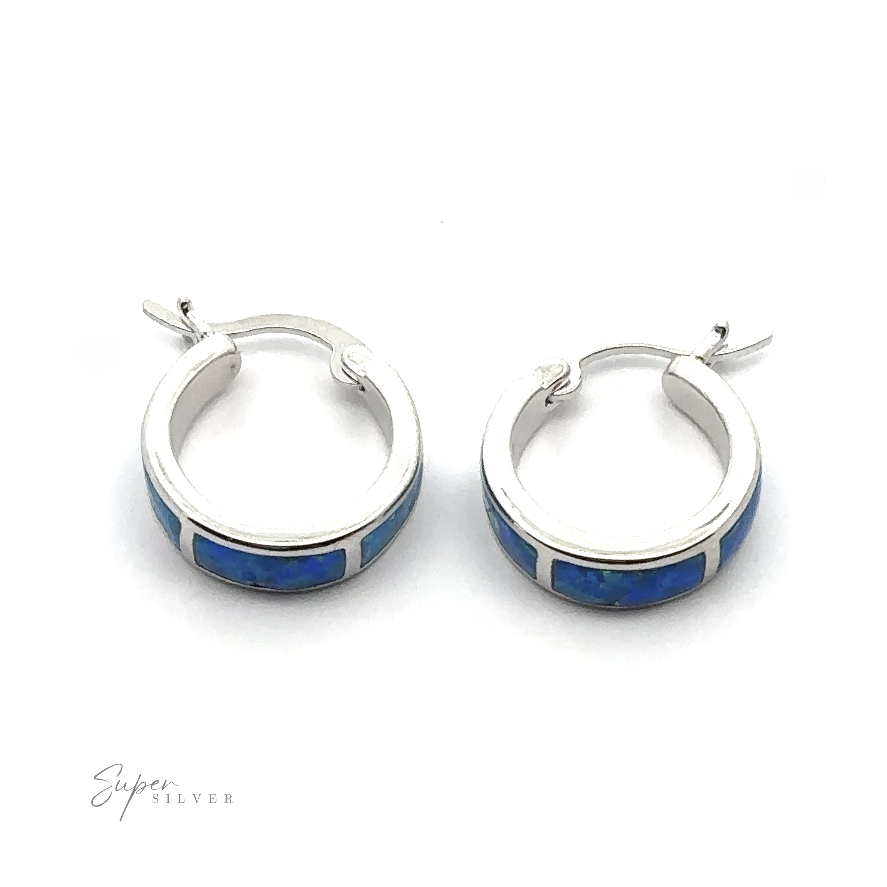 A stunning pair of Blue Lab-Created Opal Huggie Hoop Earrings on a white background, featuring an elegant rhodium finish. The brand "Super Silver" is prominently displayed in the bottom left corner.