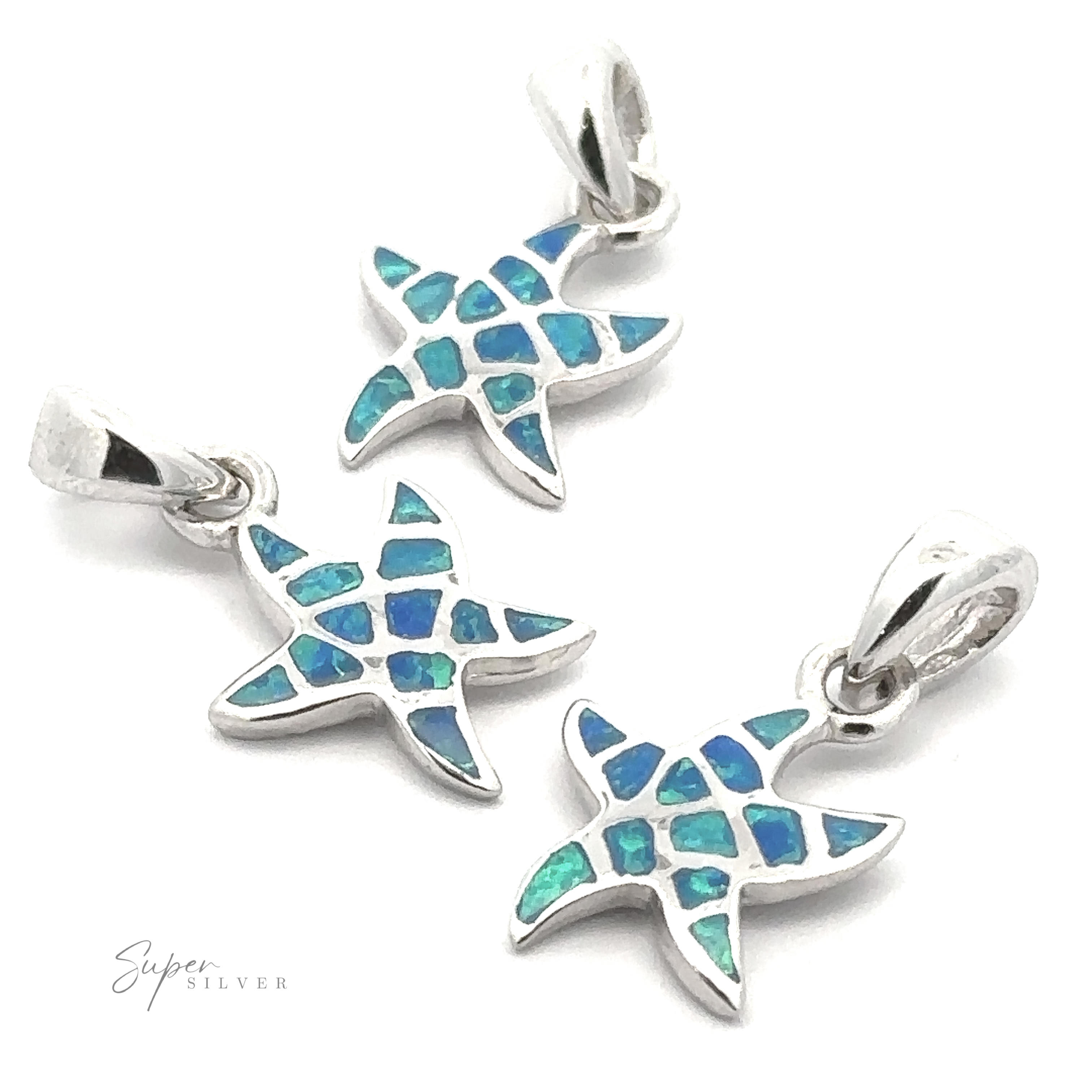 Three Small Lab-Created Opal Sea Star Pendants with blue and green mosaic inlays are arranged on a white background. The silver pendant bails are visible at the top.