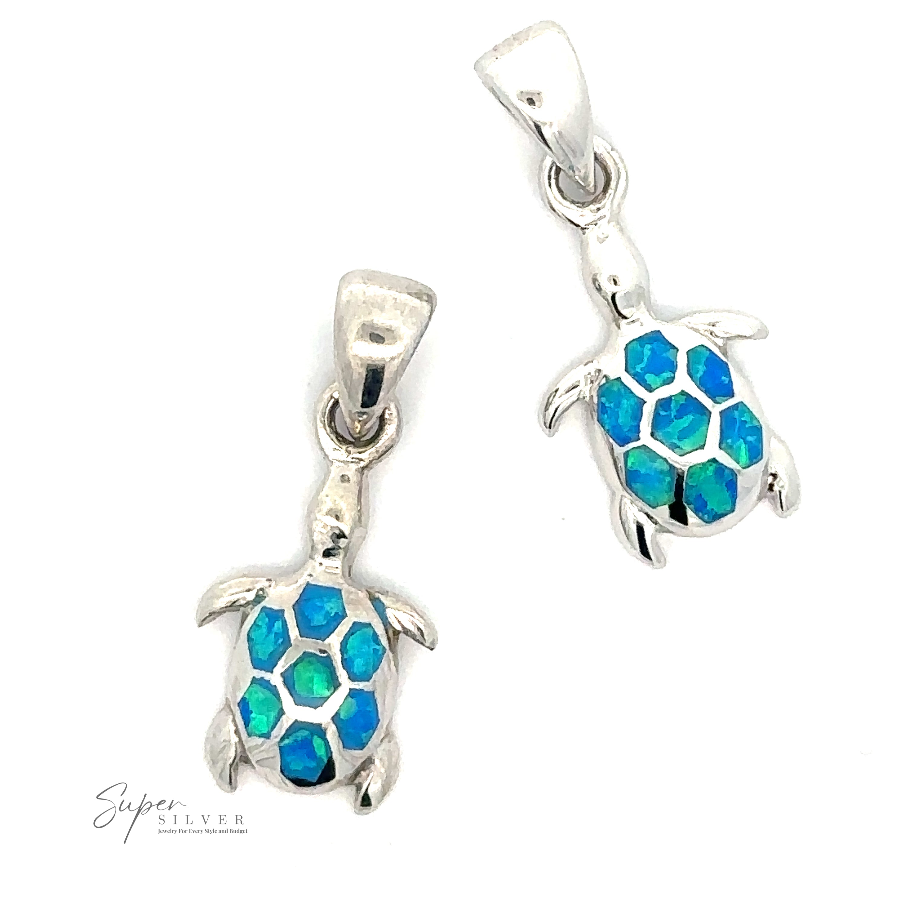 Two silver turtle pendants with blue-green hexagonal gemstones on their shells evoke the beauty of marine life. The Dainty Blue Opal Sea Turtle Pendant features a small loop at the top for attachment to a chain, and the logo text "Super Silver" is visible in the bottom left.