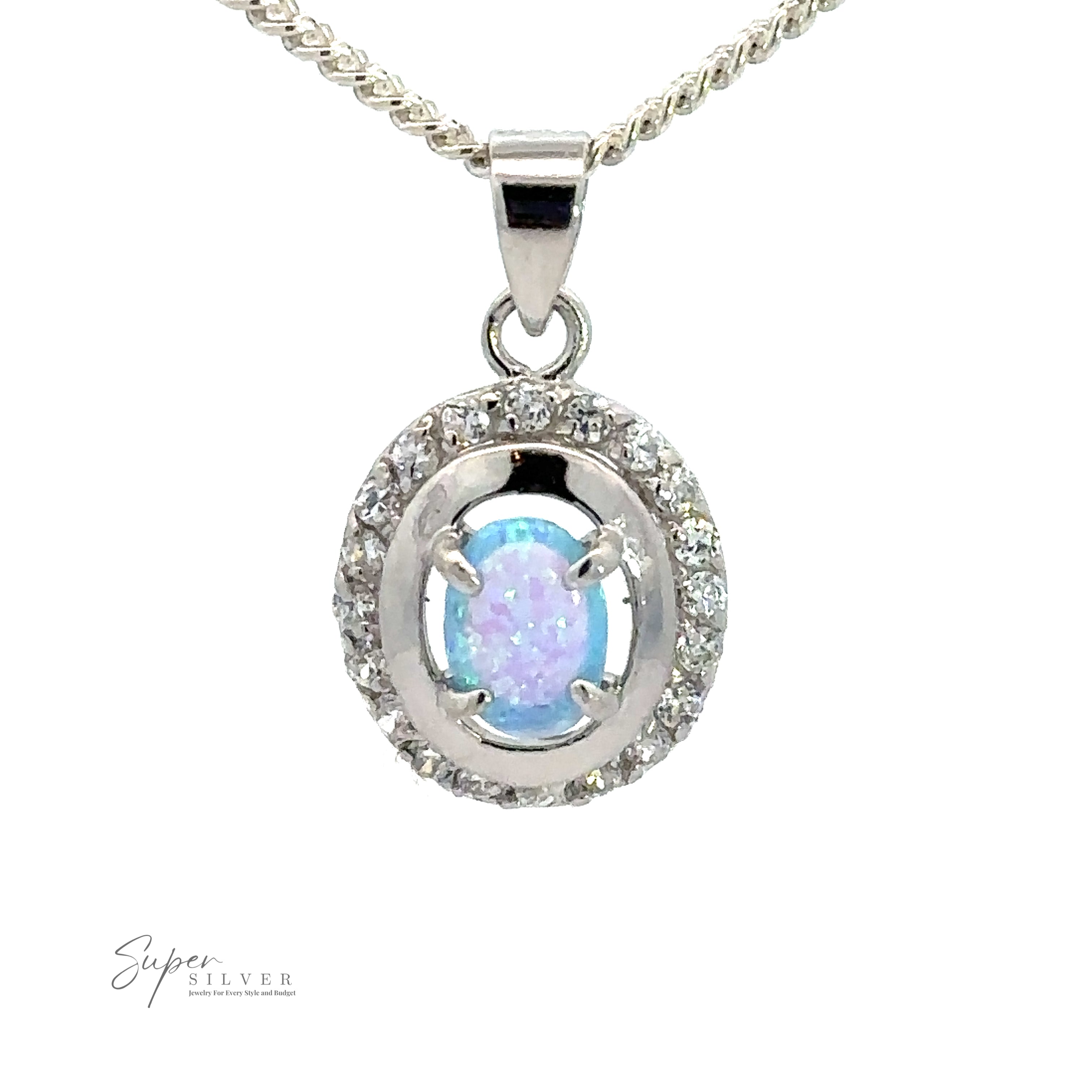 A silver necklace with a pendant featuring an oval-shaped lab-created opal at the center, surrounded by a circular arrangement of clear cubic zirconia stones, exuding the timeless elegance of Art Deco jewelry, Opal Pendants with Cubic Zirconia.