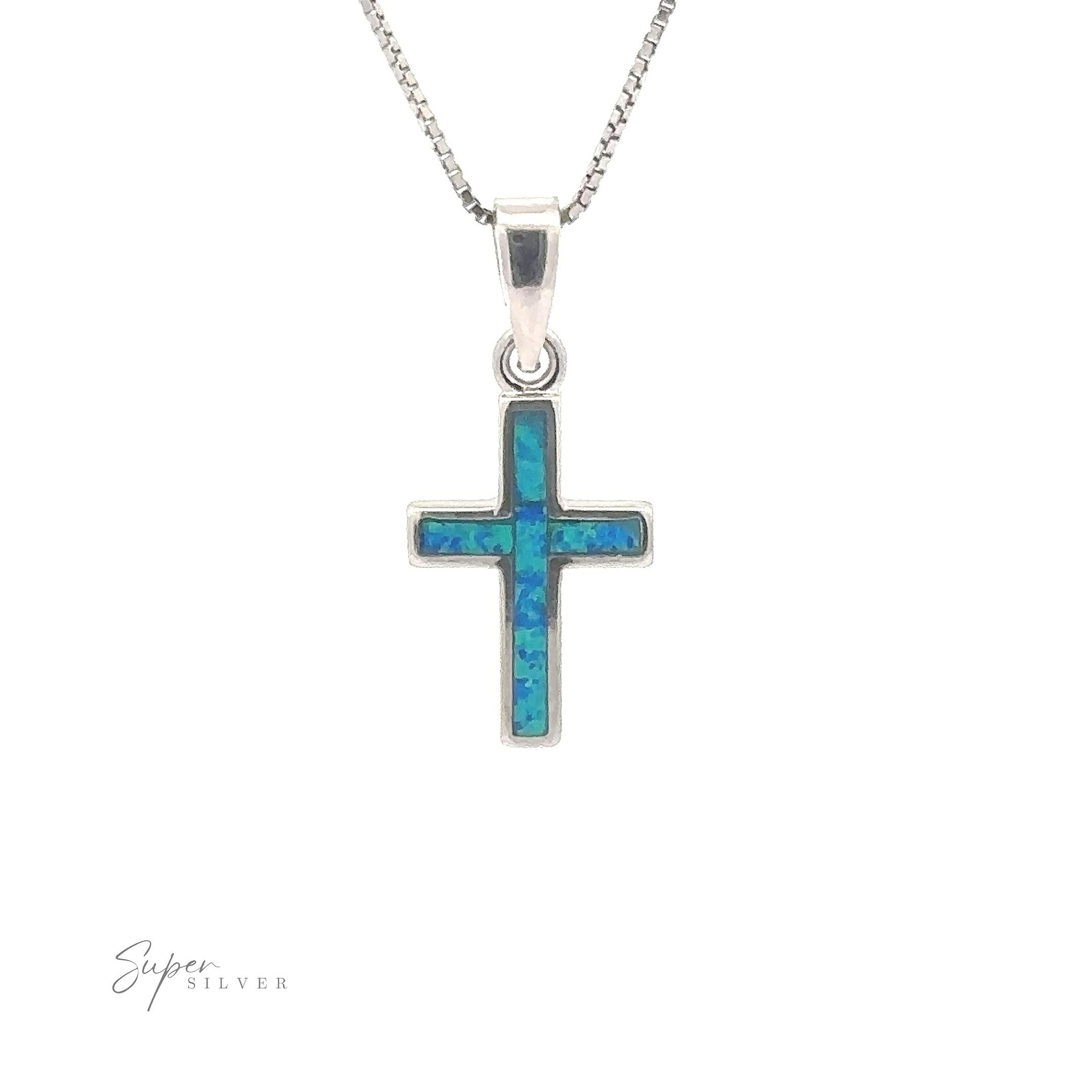 A minimalist silver necklace adorned with a vibrant pendant from our Lab-Created Opal Cross collection.