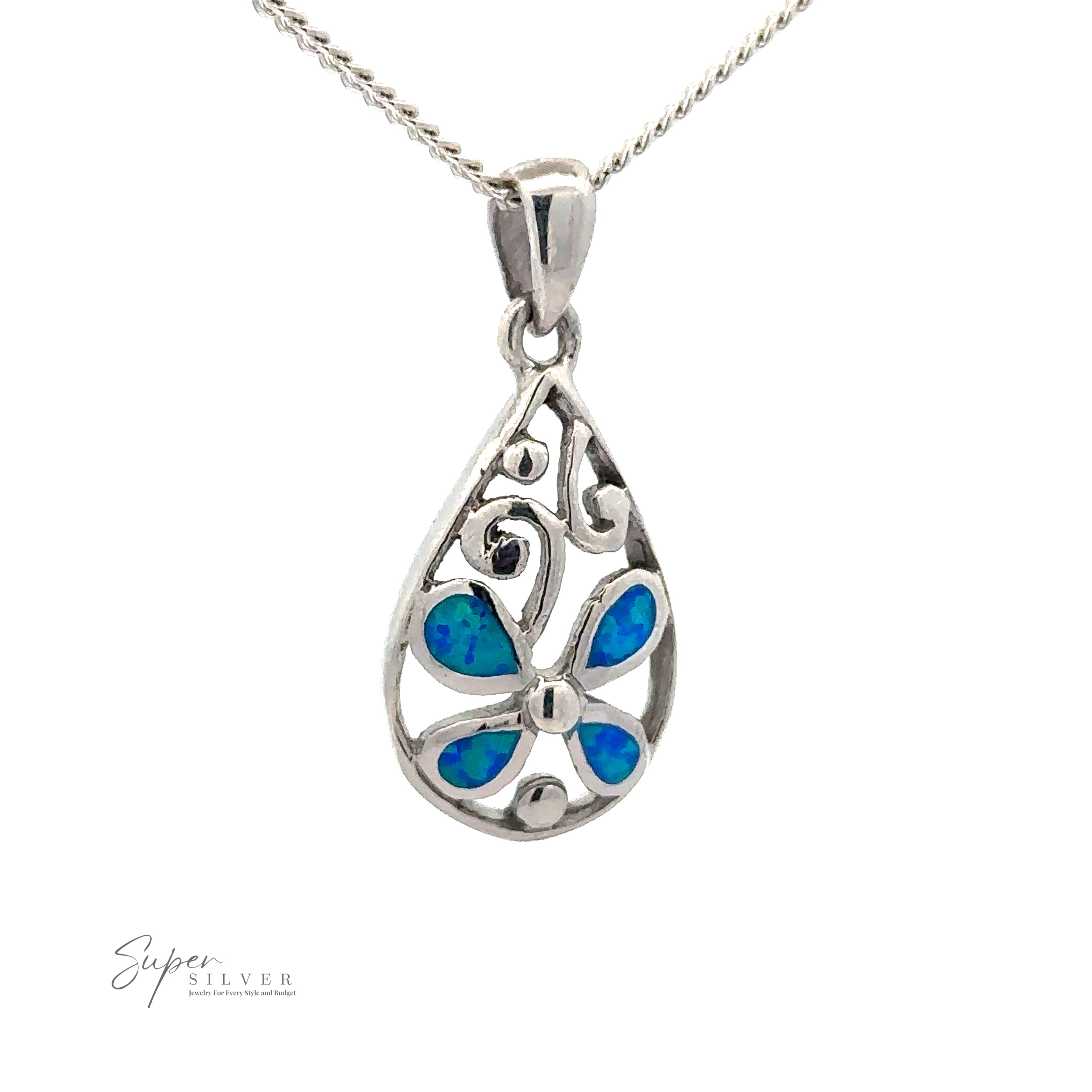 A Teardrop Blue Opal Pendant With Flower Design featuring an intricate design and a blue butterfly motif, suspended on a rhodium-finished silver chain with a lab-created opal. The text "Super Silver" is visible in the bottom left corner.