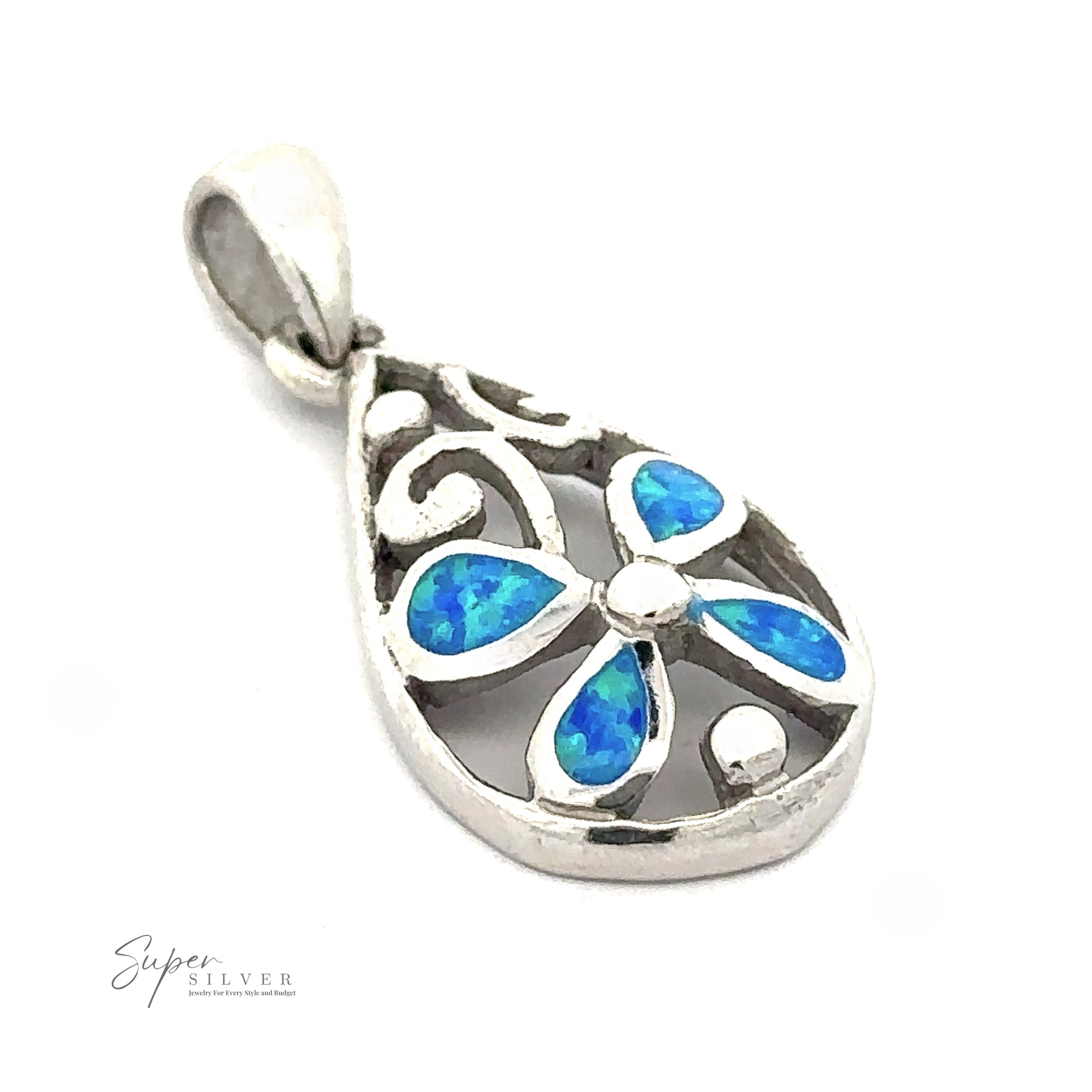 A Teardrop Blue Opal Pendant With Flower Design, featuring lab-created blue Opal gemstone inlays in a teardrop shape, is displayed against a white background. The rhodium finish adds a touch of elegance. The logo "Super Silver" is visible in the bottom left corner.