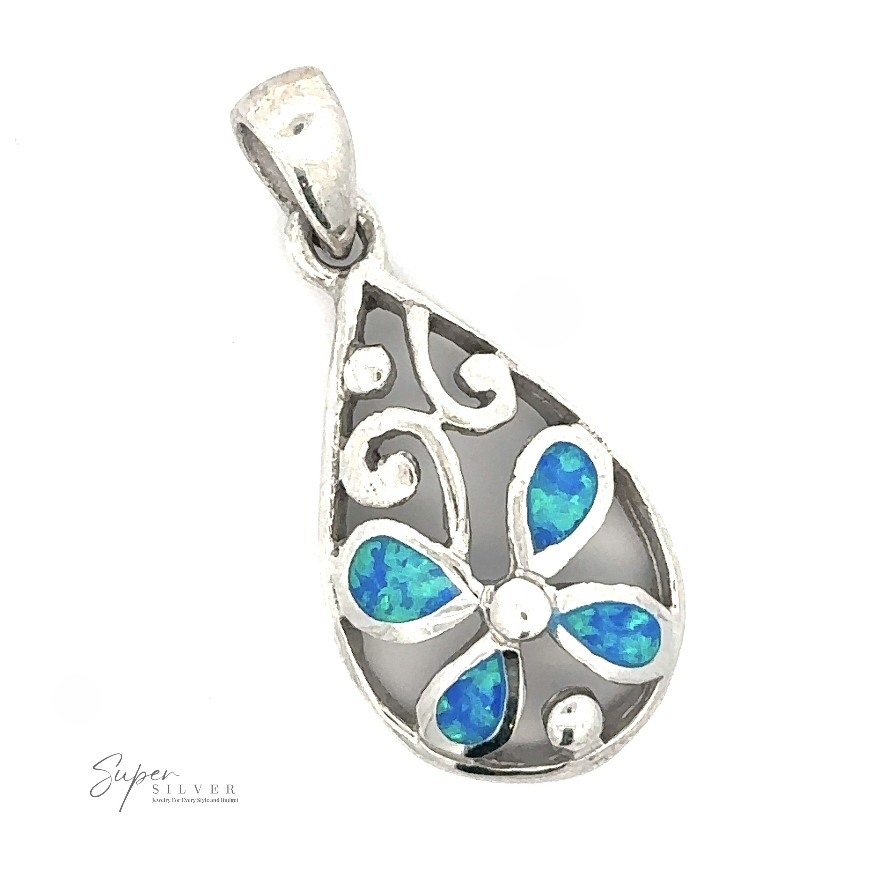 A Teardrop Blue Opal Pendant With Flower Design with a floral design featuring blue stones inset within the petals. The pendant has a loop for attaching to a chain and showcases a rhodium finish. "Super Silver" logo is visible at the bottom left.