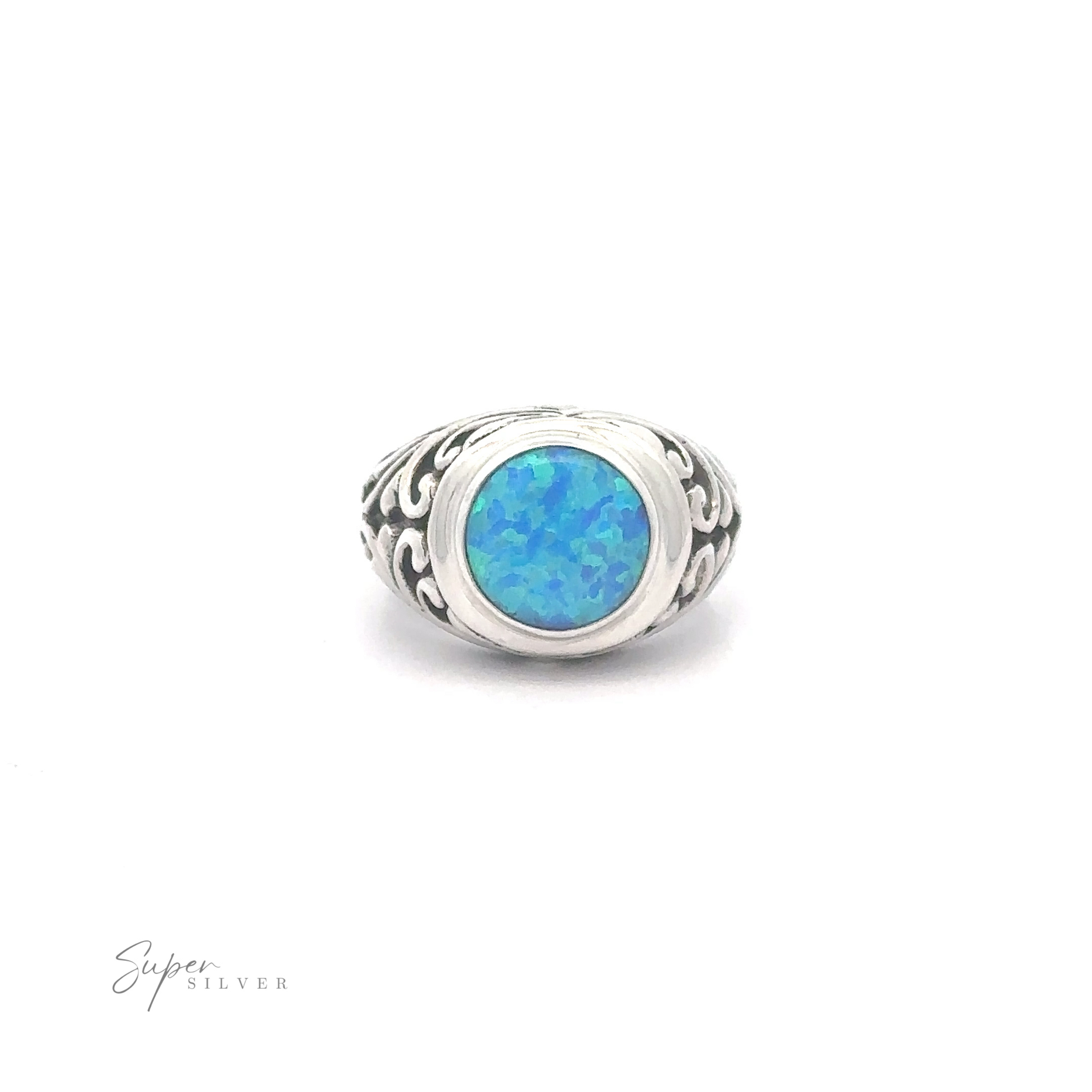 Opal Signet Ring with Bali Design with an oval blue opal set in a Bali Filigree intricate band, displayed against a white background.