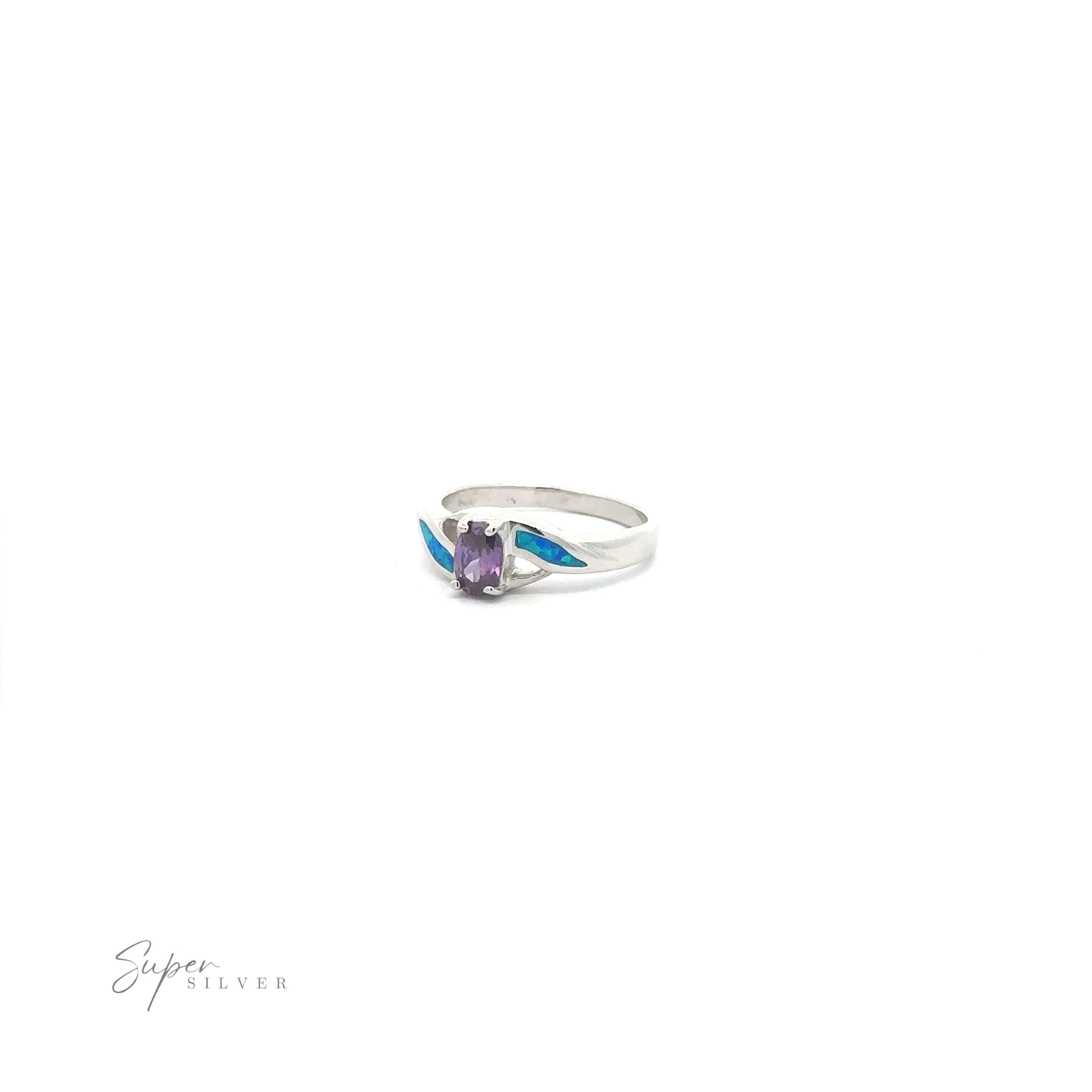 Blue Opal ring with a purple cubic zirconia on a white background.