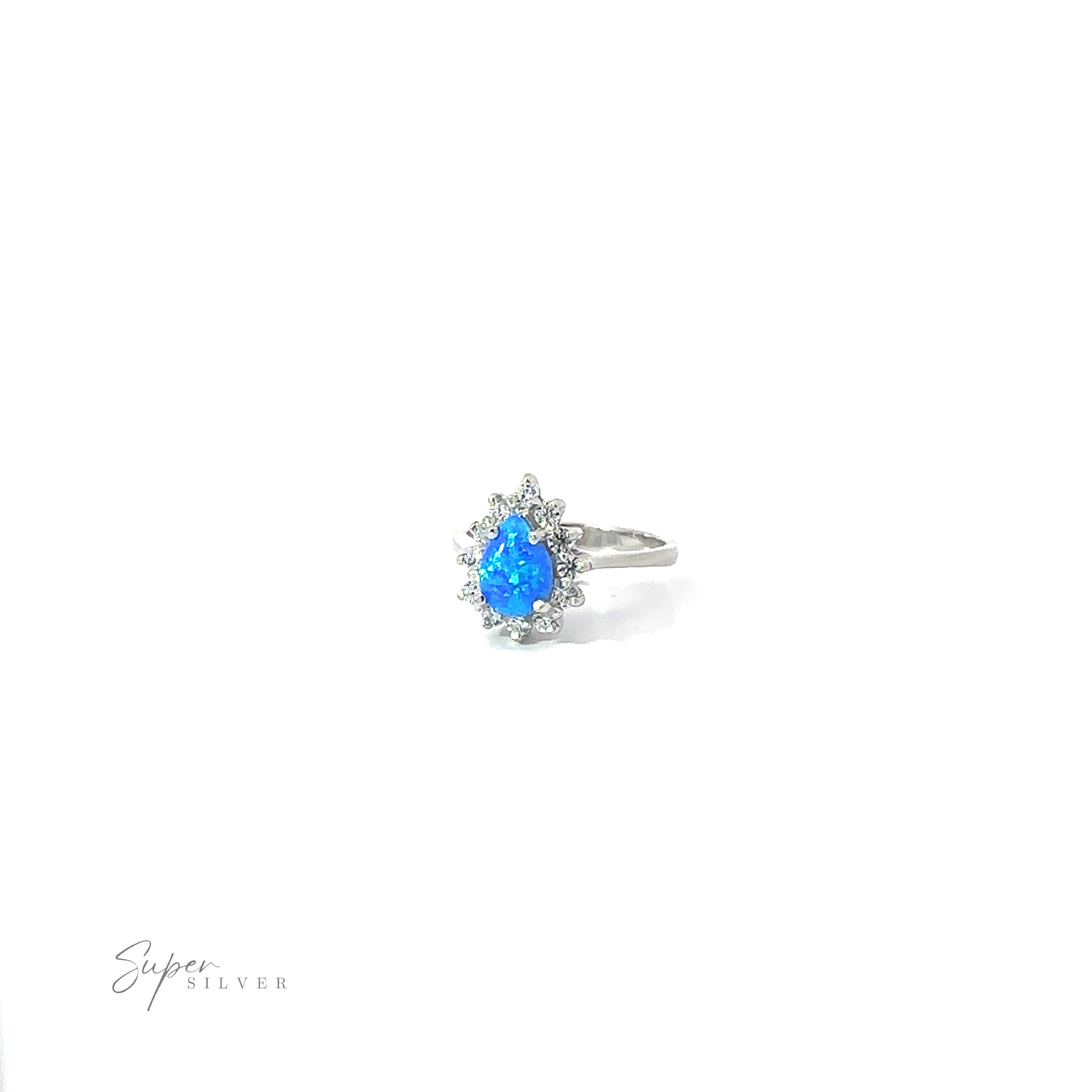 Silver Opal Teardrop Ring with Cubic Zirconias on a white background.