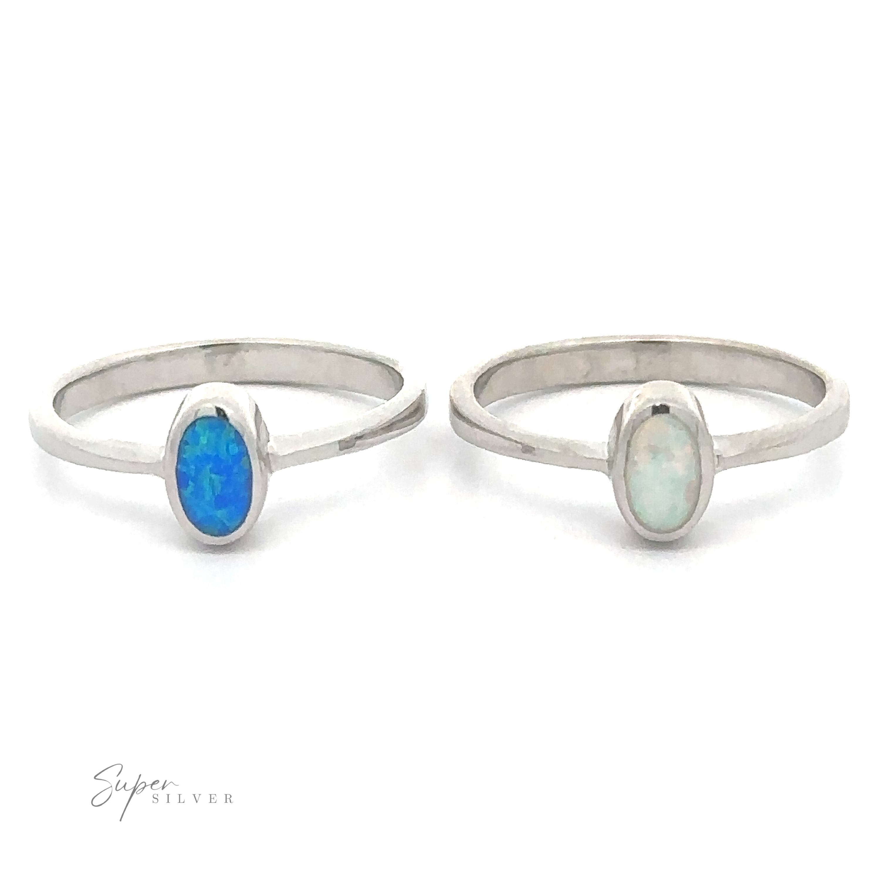 Two rhodium-plated silver rings with oval Rectangular Lab Opal gemstones on a white background.