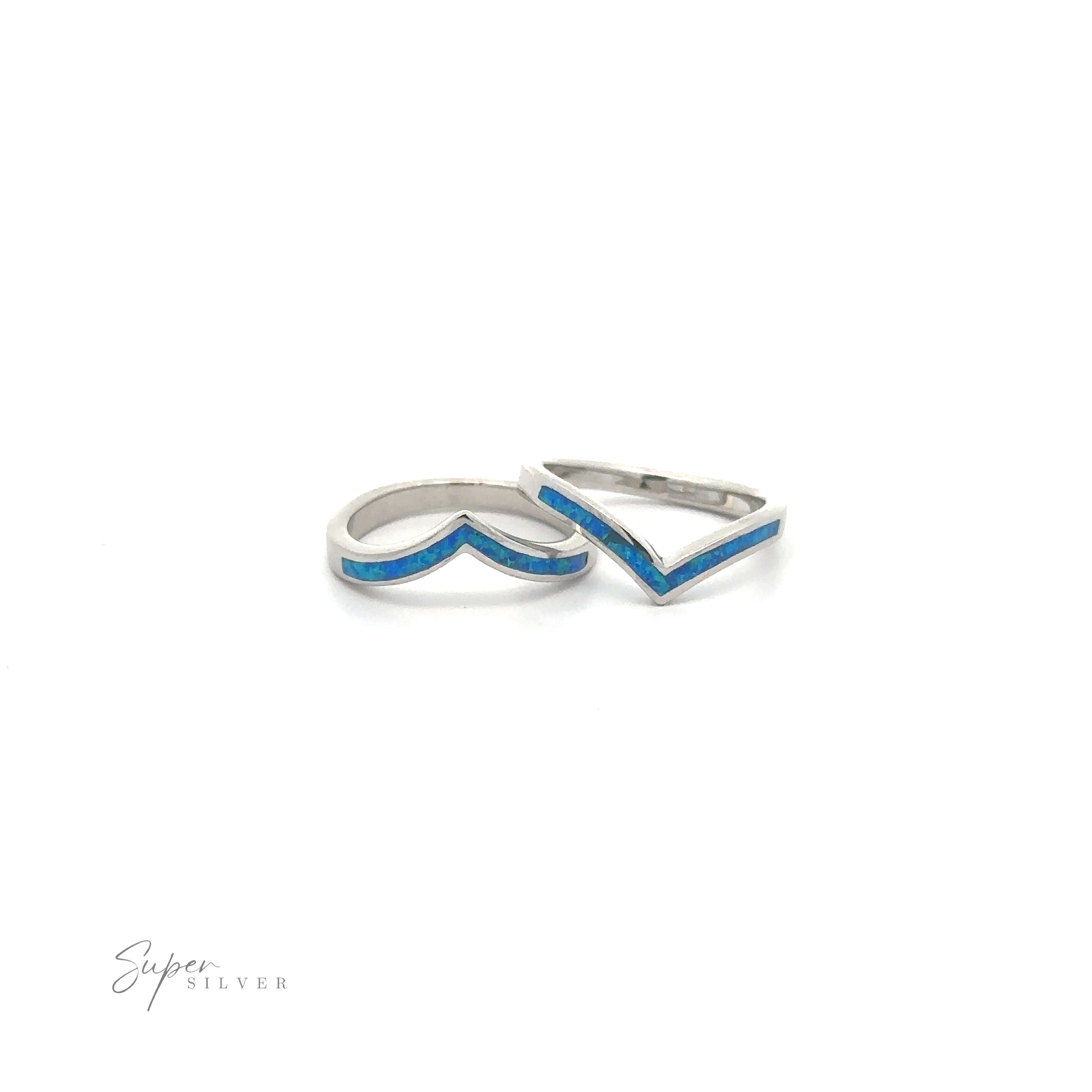 Pair of elegant silver Elegant Chevron Lab Opal Rings with blue detailing on a white background.