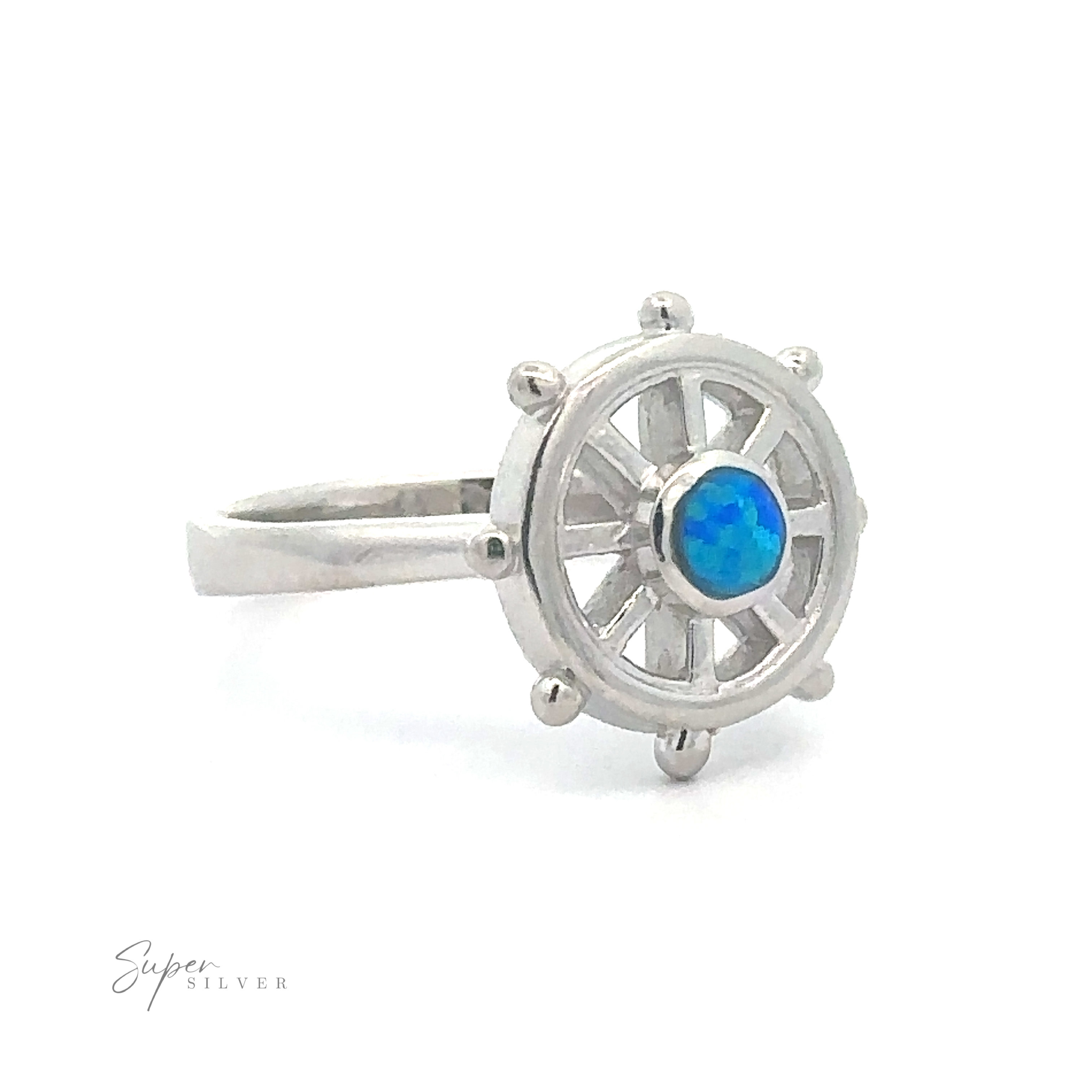 Ship Wheel Ring With Lab Opal designed to resemble a ship's wheel with an opal stone at the center.