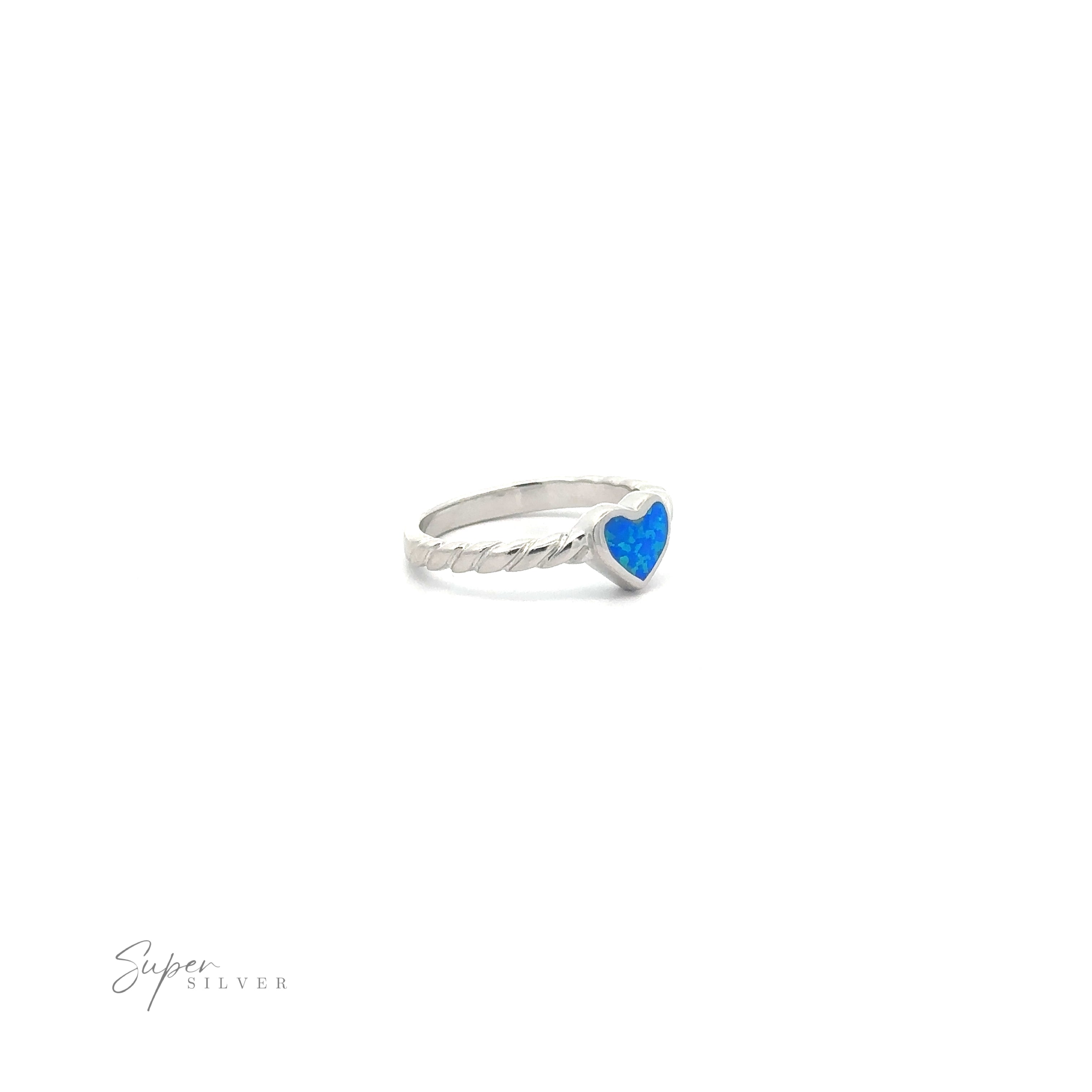 Lab Opal Heart Ring with Twisted Band with a heart-shaped blue stone against a white background.