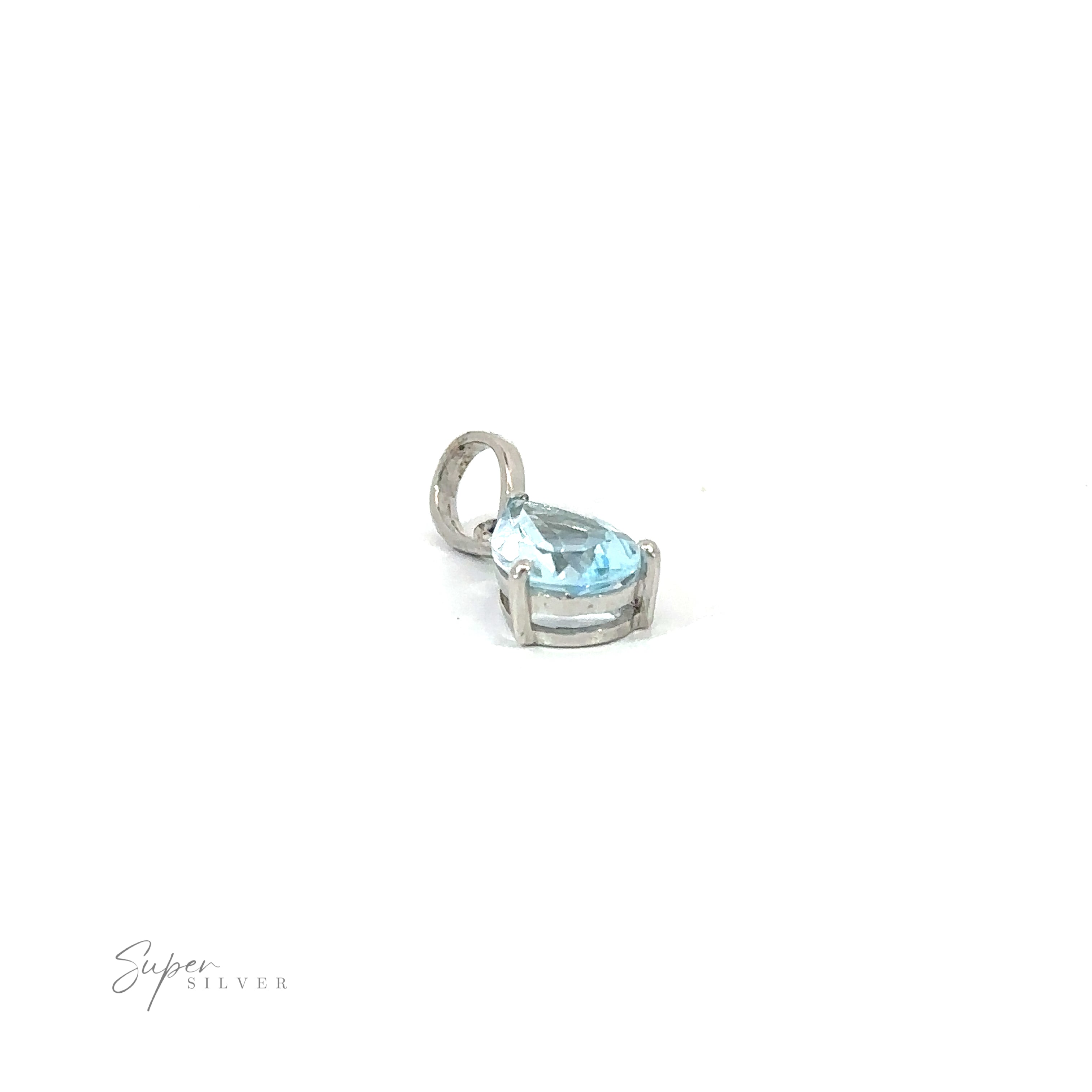 A Dainty Faceted Gemstone Pendant with a blue topaz stone, boasting a minimalist style in sterling silver.