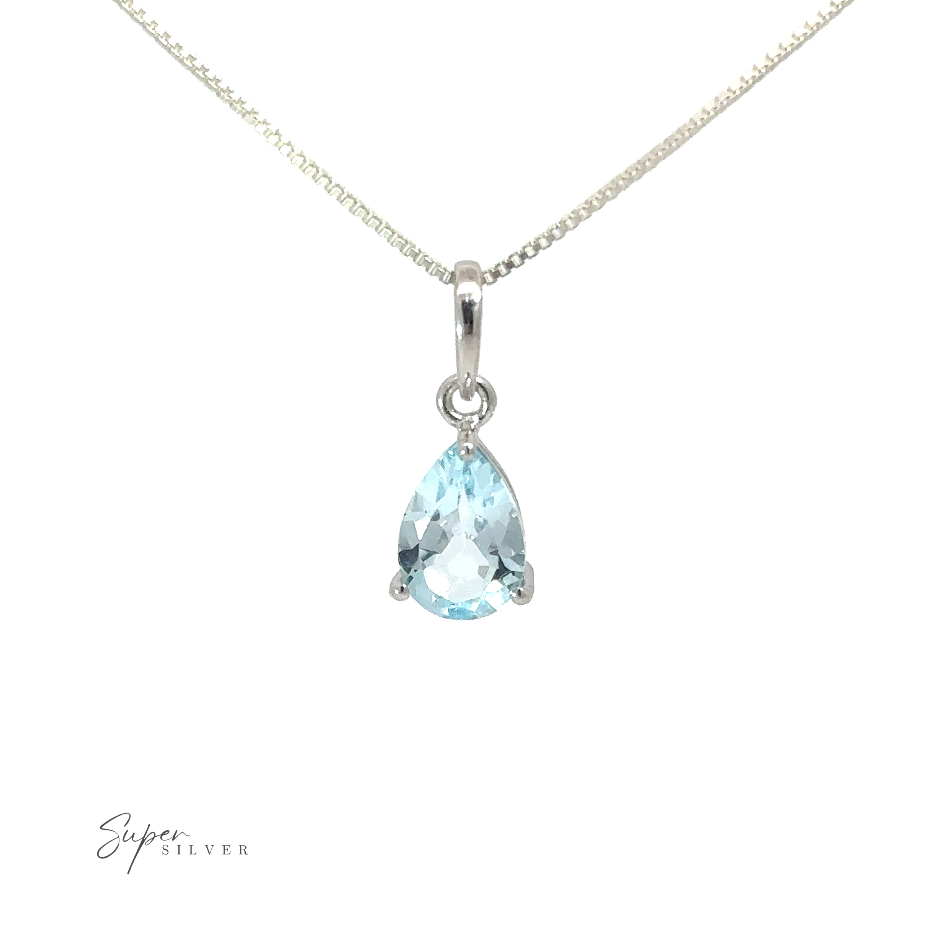 A minimalist style necklace with a Dainty Faceted Gemstone Pendant in blue.