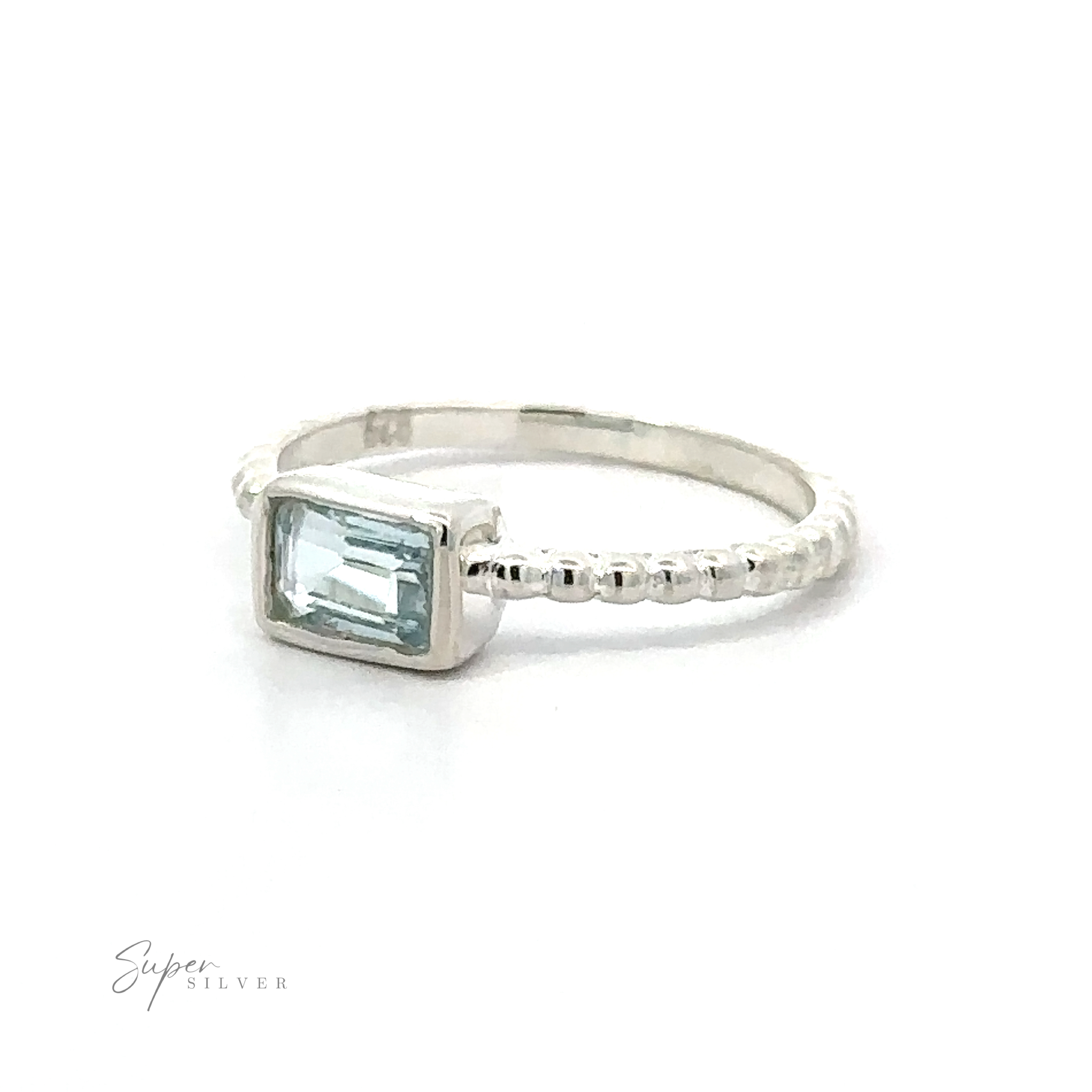 Silver Ring with a Rectangular Gemstone on a Plain Background.