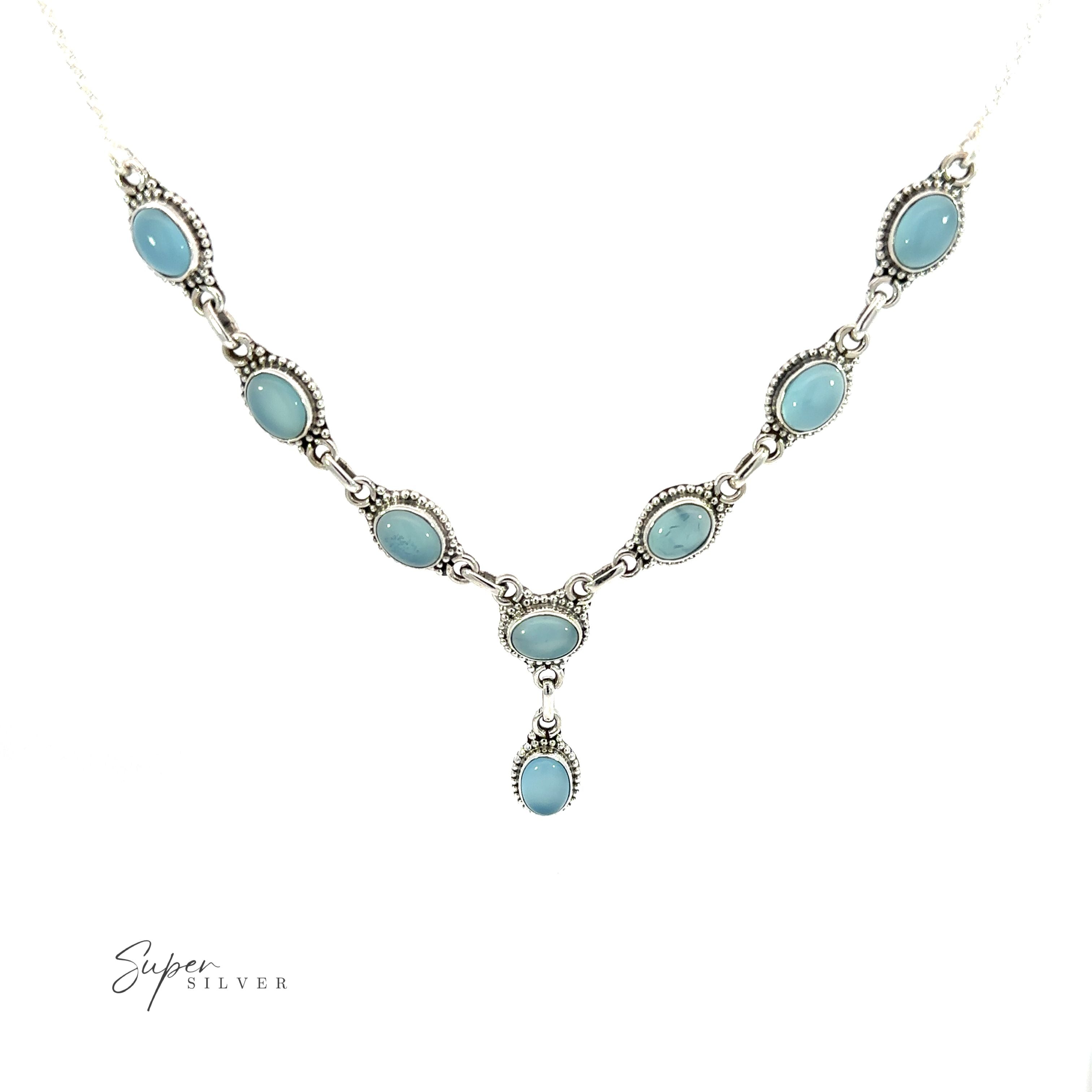 This Gemstone Y-Necklace with Beaded Border features stunning turquoise gemstones that have been carefully selected for their vibrant color and natural beauty. The necklace is made with a delicate silver chain that adds an elegant touch.