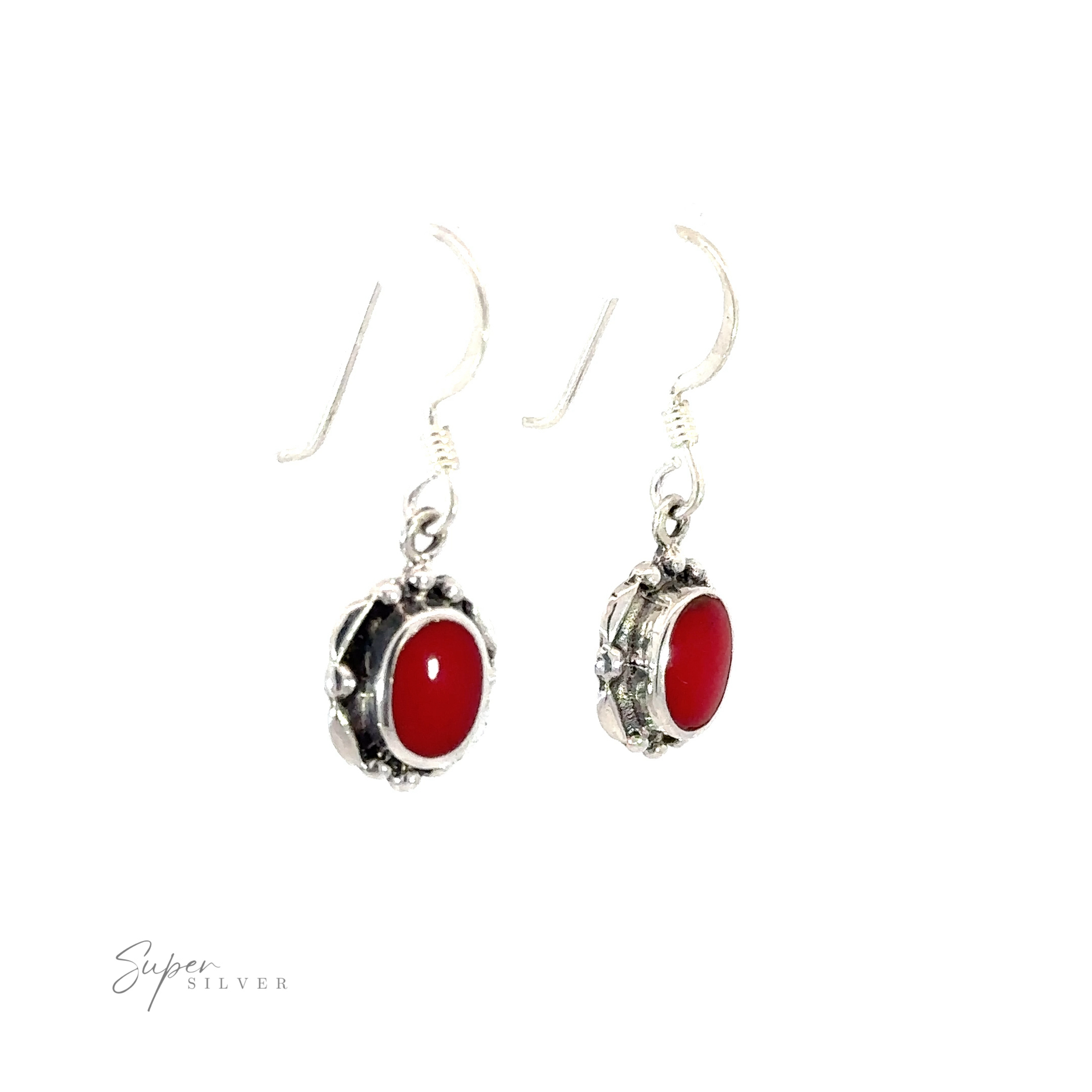 A pair of Oval Inlaid Stone earrings with inlaid red coral stones.